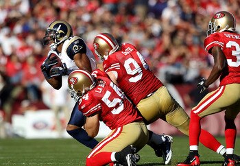 SAN FRANCISCO - NOVEMBER 14:  Brandon Gibson #11 of the St. Louis Rams is tackled by Travis LaBoy #54 and Justin Smith #94 of the San Francisco 49ers at Candlestick Park on November 14, 2010 in San Francisco, California.  (Photo by Ezra Shaw/Getty Images)