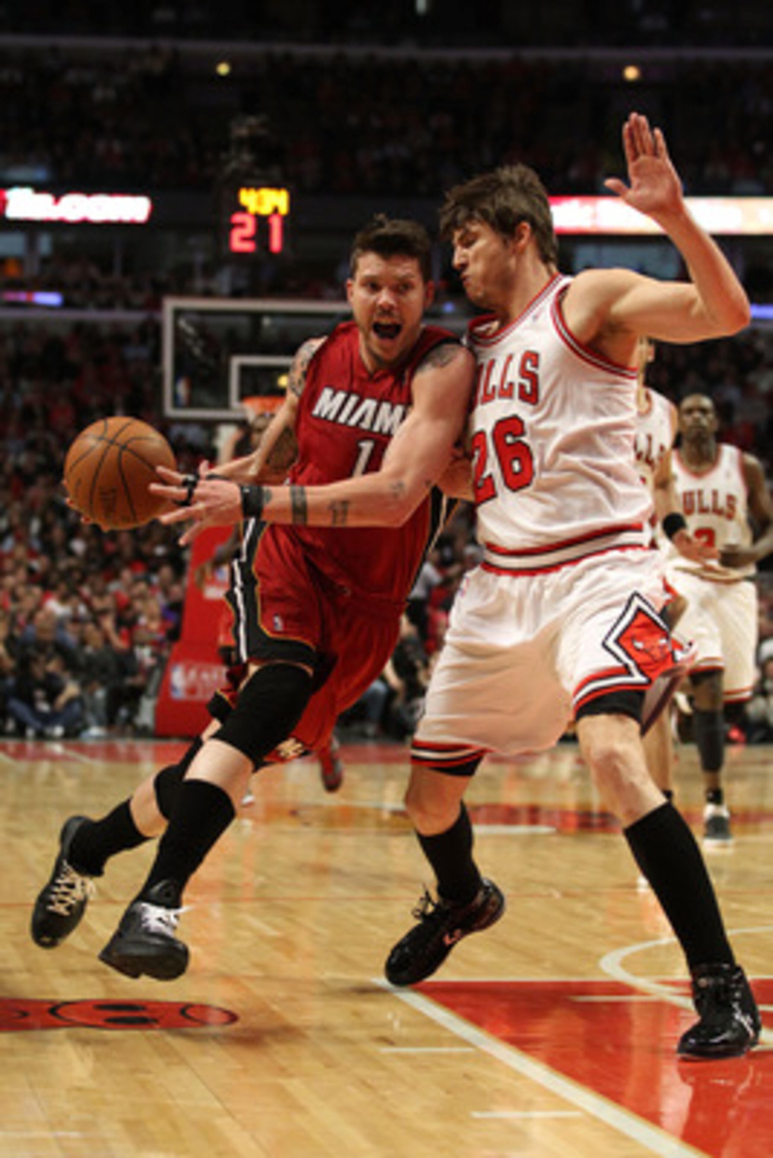 CHICAGO, IL - MAY 26:  Mike Miller #13 of the Miami Heat drives against Kyle Korver #26 of the Chicago Bulls in Game Five of the Eastern Conference Finals during the 2011 NBA Playoffs on May 26, 2011 at the United Center in Chicago, Illinois. NOTE TO USER
