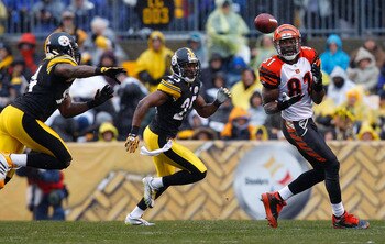 PITTSBURGH - DECEMBER 12:  Terell Owens #81 of the Cincinnati Bengals catches a pass in front of Ryan Clark #25 of the Pittsburgh Steelers during the game on December 12, 2010 at Heinz Field in Pittsburgh, Pennsylvania.  (Photo by Jared Wickerham/Getty Im