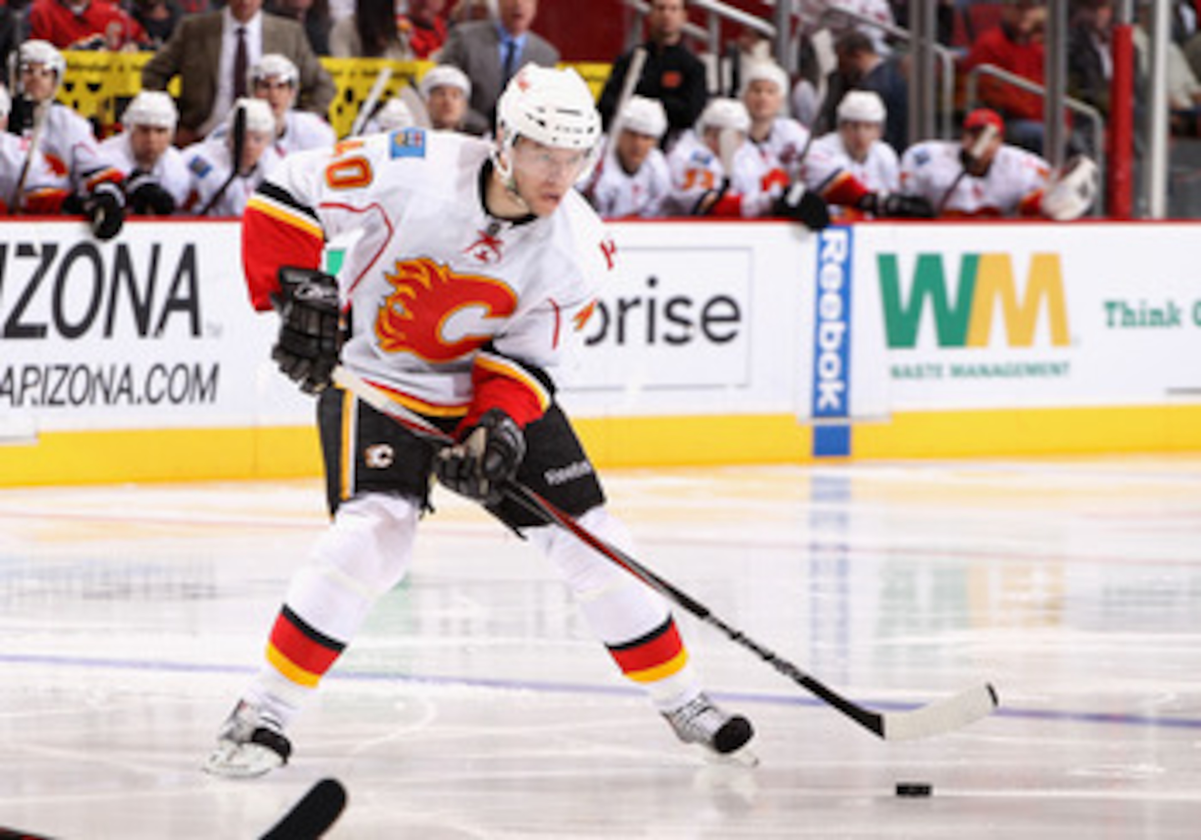 GLENDALE, AZ - MARCH 10:  Alex Tanguay #40 of the Calgary Flames skates with the puck during the NHL game against the Phoenix Coyotes at Jobing.com Arena on March 10, 2011 in Glendale, Arizona.  The Coyotes defeated the Flames 3-0.  (Photo by Christian Pe
