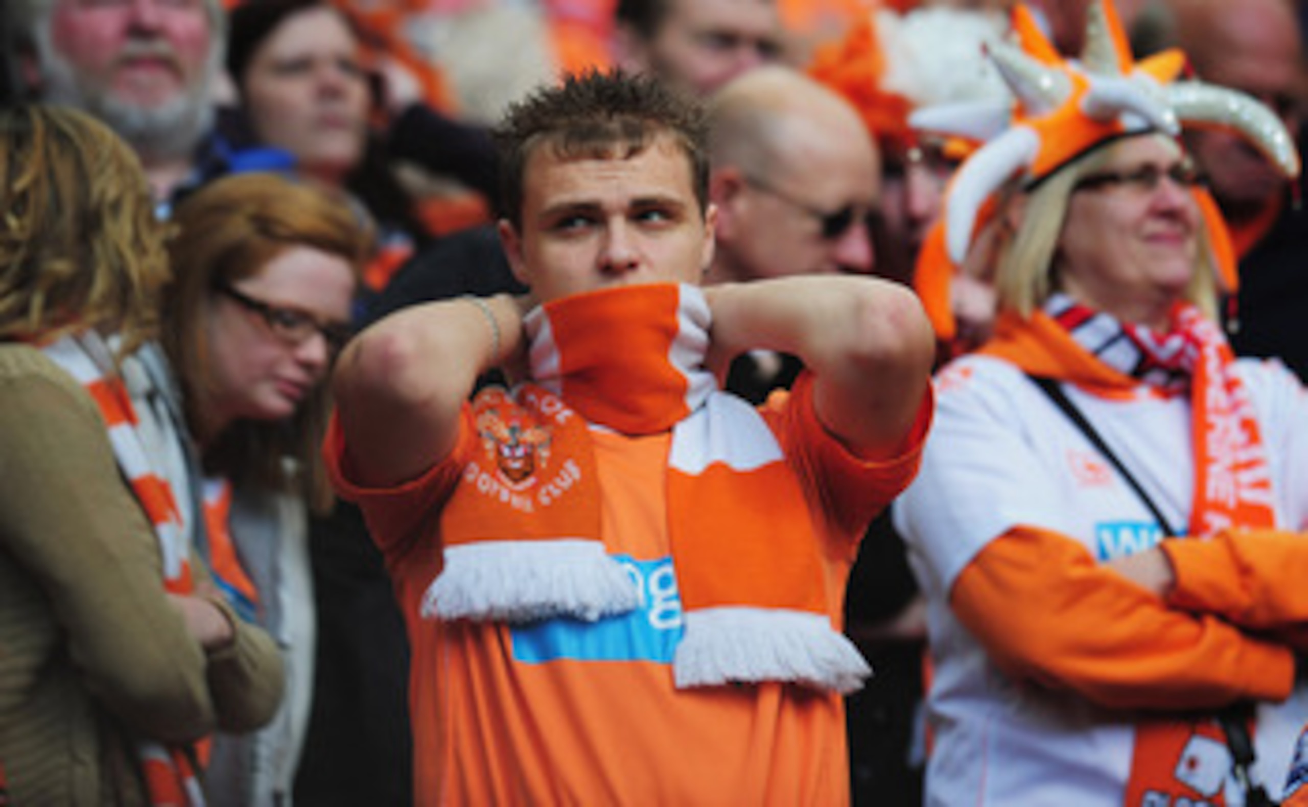 MANCHESTER, ENGLAND - MAY 22:  A Blackpool fan looks dejected as they are relegated during the Barclays Premier League match between Manchester United and Blackpool at Old Trafford on May 22, 2011 in Manchester, England.  (Photo by Shaun Botterill/Getty I