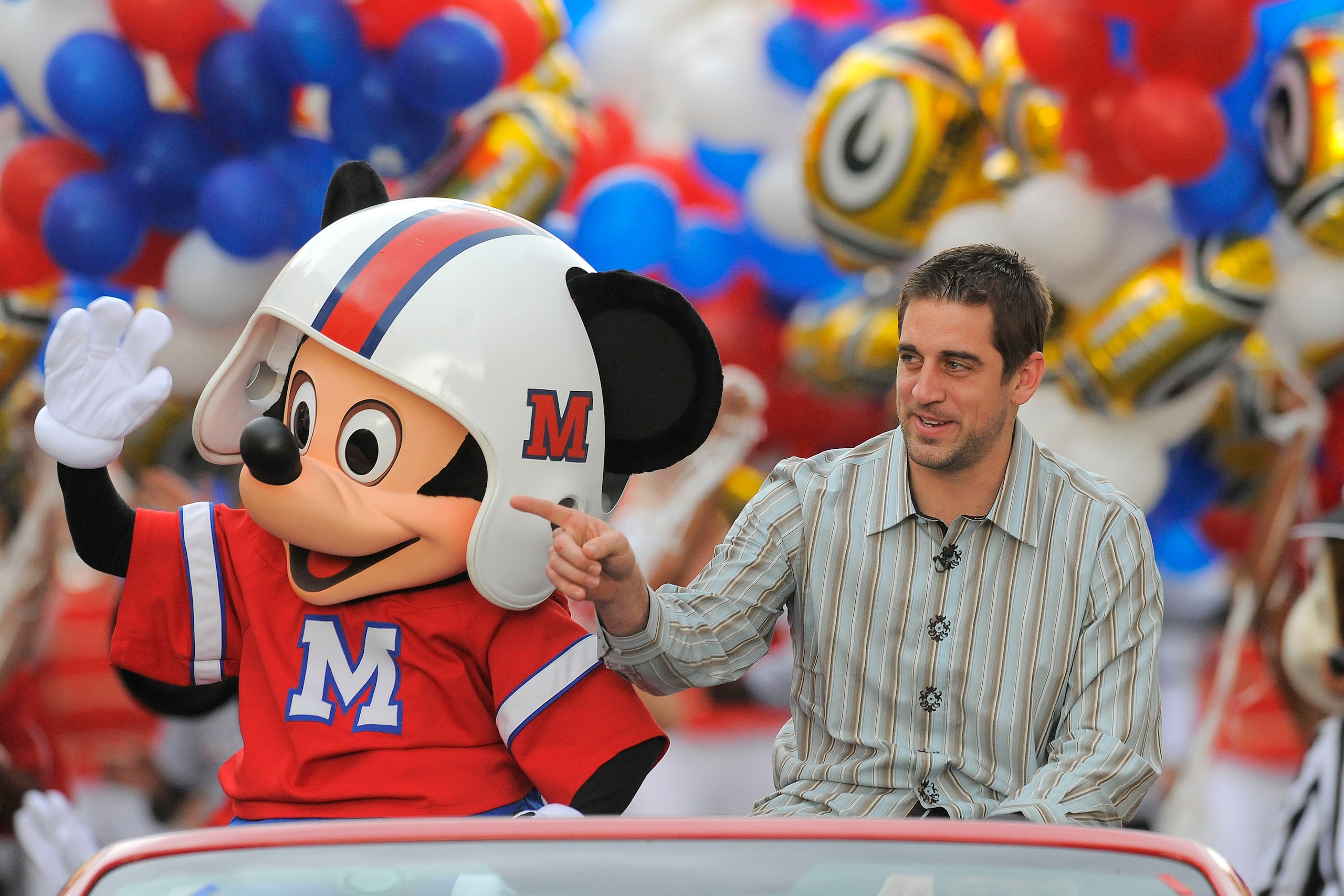 LAKE BUENA VISTA, FL - FEBRUARY 07: In this handout photo provided by Disney, Super Bowl XLV Most Valuable Player Aaron Rodgers takes a celebratory ride with Mickey Mouse, following the Green Bay Packers' 31-25 victory over the Pittsburgh Steelers Februa LAKE BUENA VISTA, FL - FEBRUARY 07: In this handout photo provided by Disney, Super Bowl XLV Most Valuable Player Aaron Rodgers takes a celebratory ride with Mickey Mouse, following the Green Bay Packers' 31-25 victory over the Pittsburgh Steelers Februa