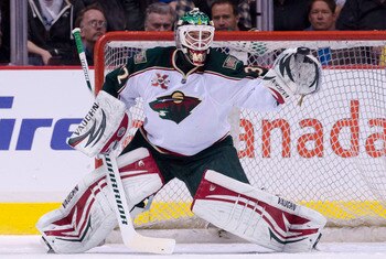 VANCOUVER, CANADA - APRIL 7: Golie Niklas Backstrom #32 of the Minnesota Wild reaches out to grab a shot by the Vancouver Canucks during the first period in NHL action on April 07, 2011 at Rogers Arena in Vancouver, BC, Canada.  (Photo by Rich Lam/Getty I