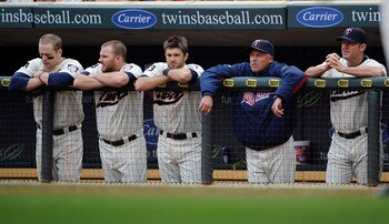 MINNEAPOLIS, MN - MAY 29: Justin Morneau #33 (L), Jason Kubel #16, Drew Butera #41, pitching coach Rick Anderson #40 and Jim Thome #25 of the Minnesota Twins during the ninth inning of their game against the Los Angeles Angels of Anaheim on May 29, 2011 a