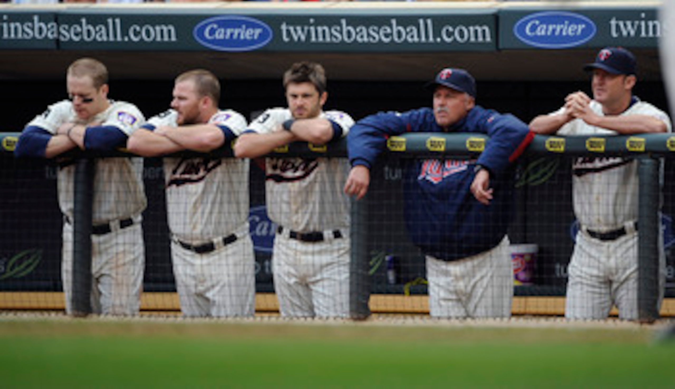 MINNEAPOLIS, MN - MAY 29: Justin Morneau #33 (L), Jason Kubel #16, Drew Butera #41, pitching coach Rick Anderson #40 and Jim Thome #25 of the Minnesota Twins during the ninth inning of their game against the Los Angeles Angels of Anaheim on May 29, 2011 a