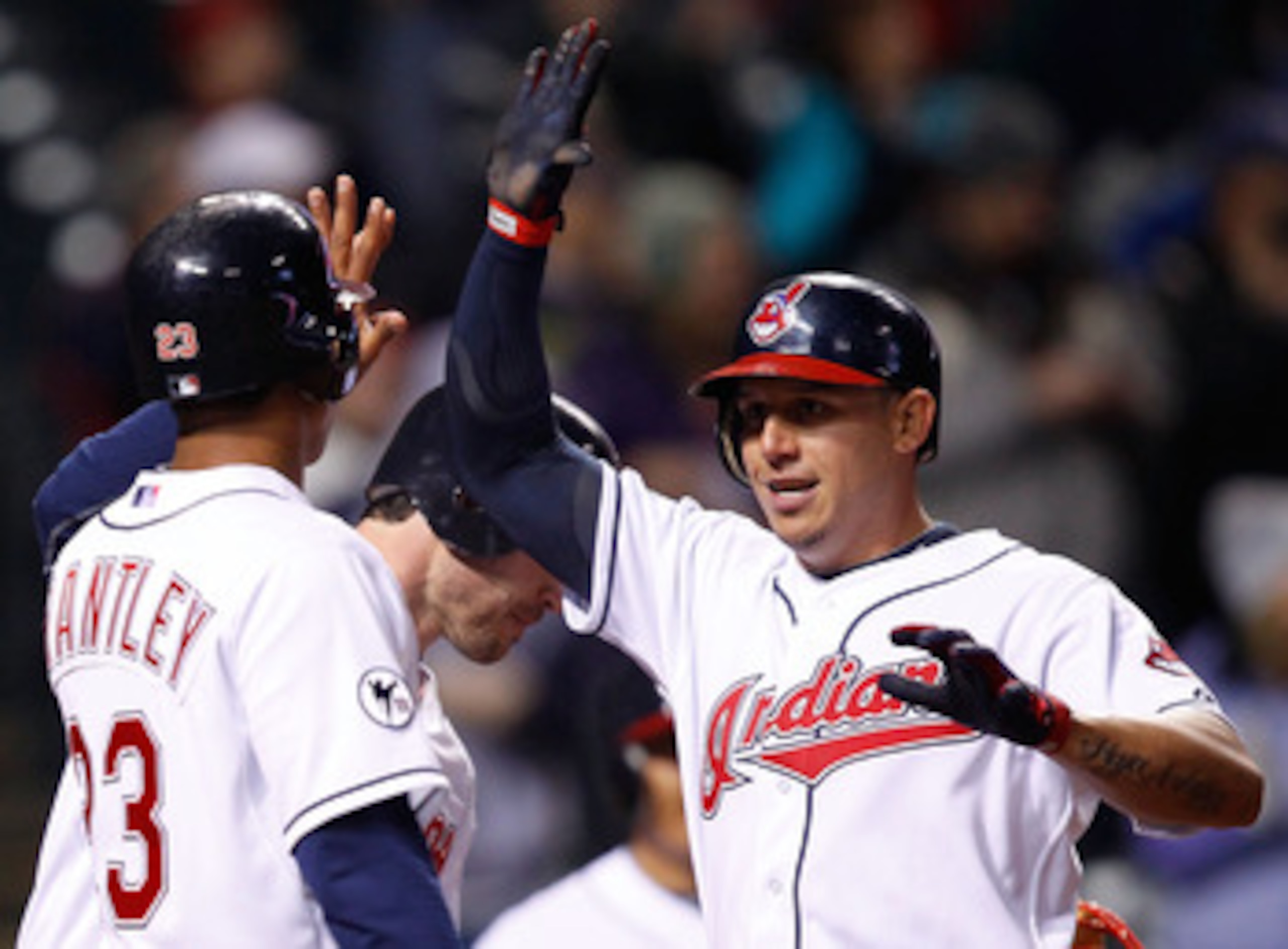 CLEVELAND - APRIL 06:  Asdrubal Cabrera #13 of the Cleveland Indians celebrates with his teammates after hitting a three run home run against he Boston Red Sox during the game on April 6, 2011 at Progressive Field in Cleveland, Ohio.  (Photo by Jared Wick