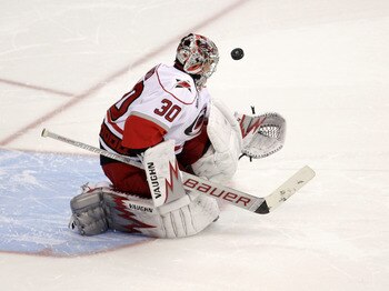 WASHINGTON, DC - MARCH 29:  Goalie Cam Ward #30 of the Carolina Hurricanes blocks a shot on goal during a shootout against the Washington Capitals at the Verizon Center on March 29, 2011 in Washington, DC. (Photo by Rob Carr/Getty Images)