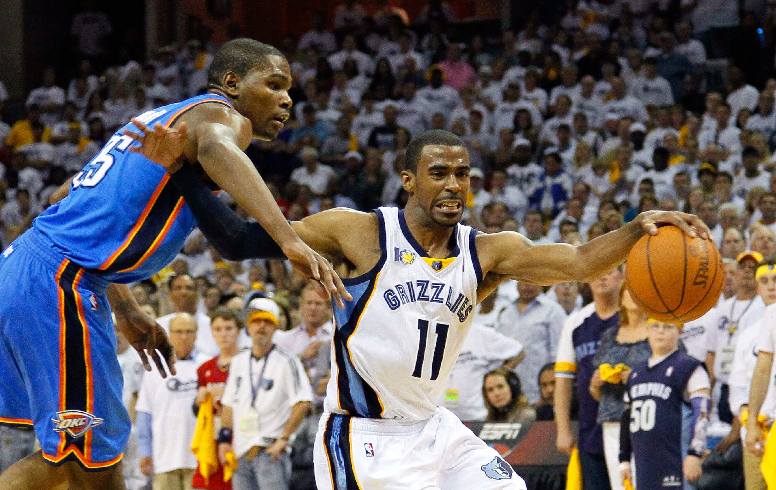 MEMPHIS, TN - MAY 13:  Kevin Durant #35 of the Oklahoma City Thunder fouls Mike Conley #11 of the Memphis Grizzlies in Game Six of the Western Conference Semifinals in the 2011 NBA Playoffs at FedExForum on May 13, 2011 in Memphis, Tennessee.  NOTE TO USE