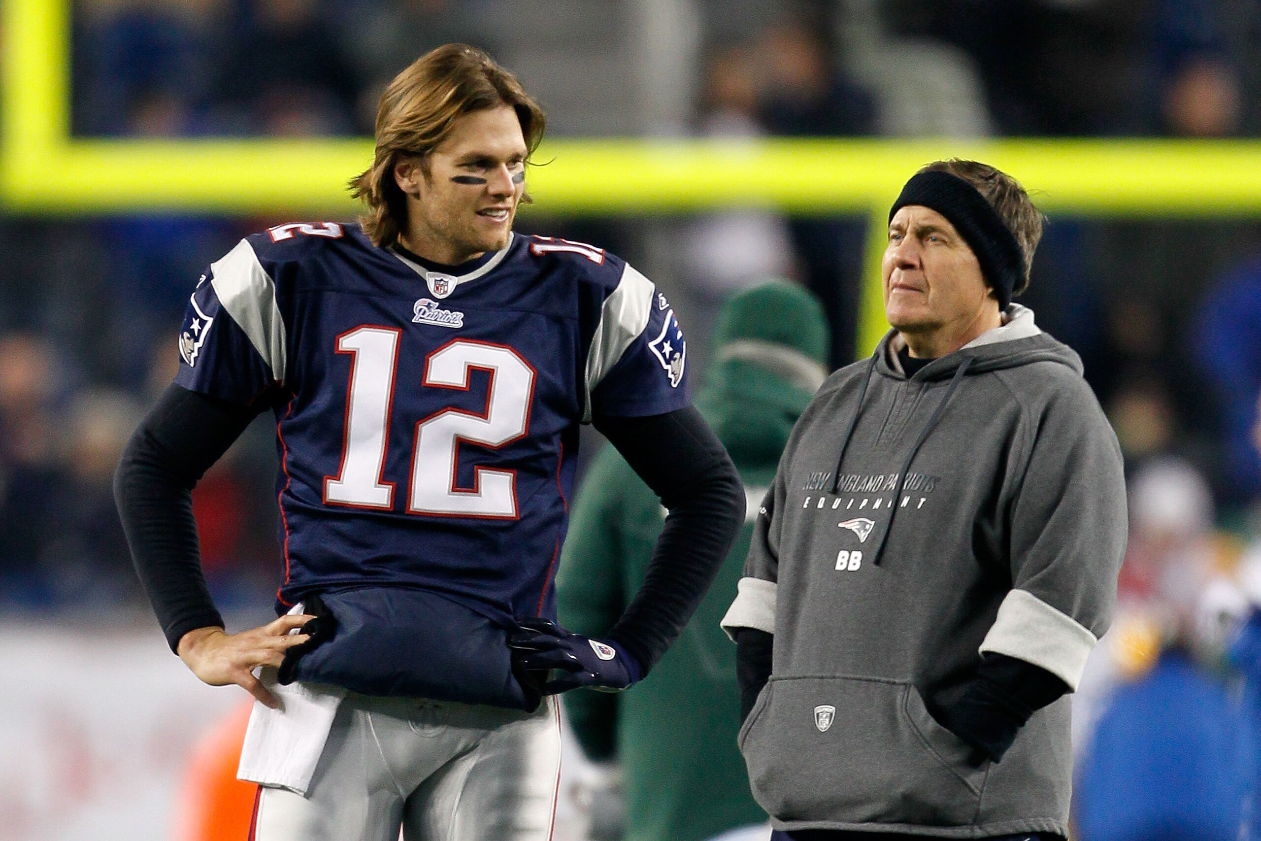 FOXBORO, MA - DECEMBER 19: Quarterback Tom Brady #12 of the New England Patriots talks with head coach Bill Belichick before playing against the Green Bay Packers at Gillette Stadium on December 19, 2010 in Foxboro, Massachusetts. The Patriots won the g FOXBORO, MA - DECEMBER 19: Quarterback Tom Brady #12 of the New England Patriots talks with head coach Bill Belichick before playing against the Green Bay Packers at Gillette Stadium on December 19, 2010 in Foxboro, Massachusetts. The Patriots won the g