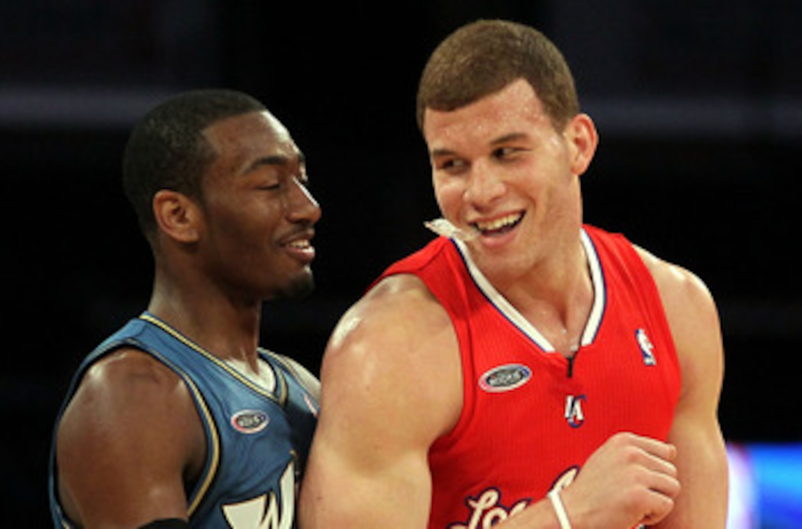 LOS ANGELES, CA - FEBRUARY 18:  John Wall #2 of the Washington Wizards and the Rookie Team and Blake Griffin #32 of the Los Angeles Clippers and the Rookie Team laugh on the court in the second half during the T-Mobile Rookie Challenge and Youth Jam at St