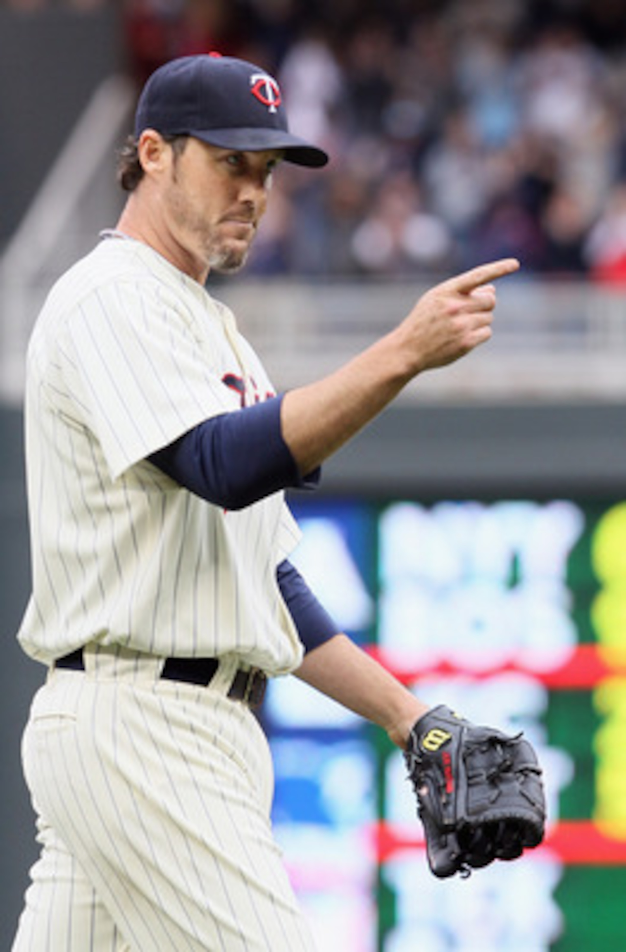 MINNEAPOLIS, MN - APRIL 08: Joe Nathan #36 of the Minnesota Twins celebrates the win over the Oakland Athletics during Opening Day on April 8, 2011 at Target Field in Minneapolis, Minnesota. The Minnesota Twins defeated the Oakland Athletics 2-1. (Photo MINNEAPOLIS, MN - APRIL 08: Joe Nathan #36 of the Minnesota Twins celebrates the win over the Oakland Athletics during Opening Day on April 8, 2011 at Target Field in Minneapolis, Minnesota. The Minnesota Twins defeated the Oakland Athletics 2-1. (Photo