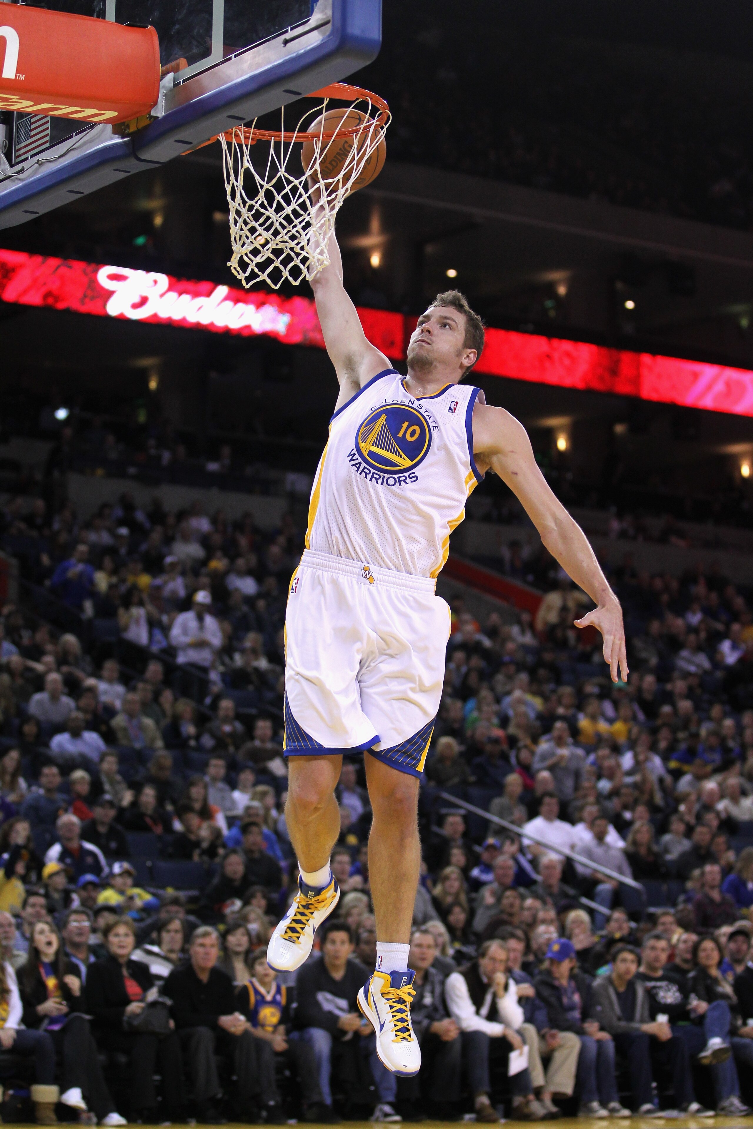 OAKLAND, CA - MARCH 25:  David Lee #10 of the Golden State Warriors in action against the Toronto Raptors at Oracle Arena on March 25, 2011 in Oakland, California. NOTE TO USER: User expressly acknowledges and agrees that, by downloading and or using this