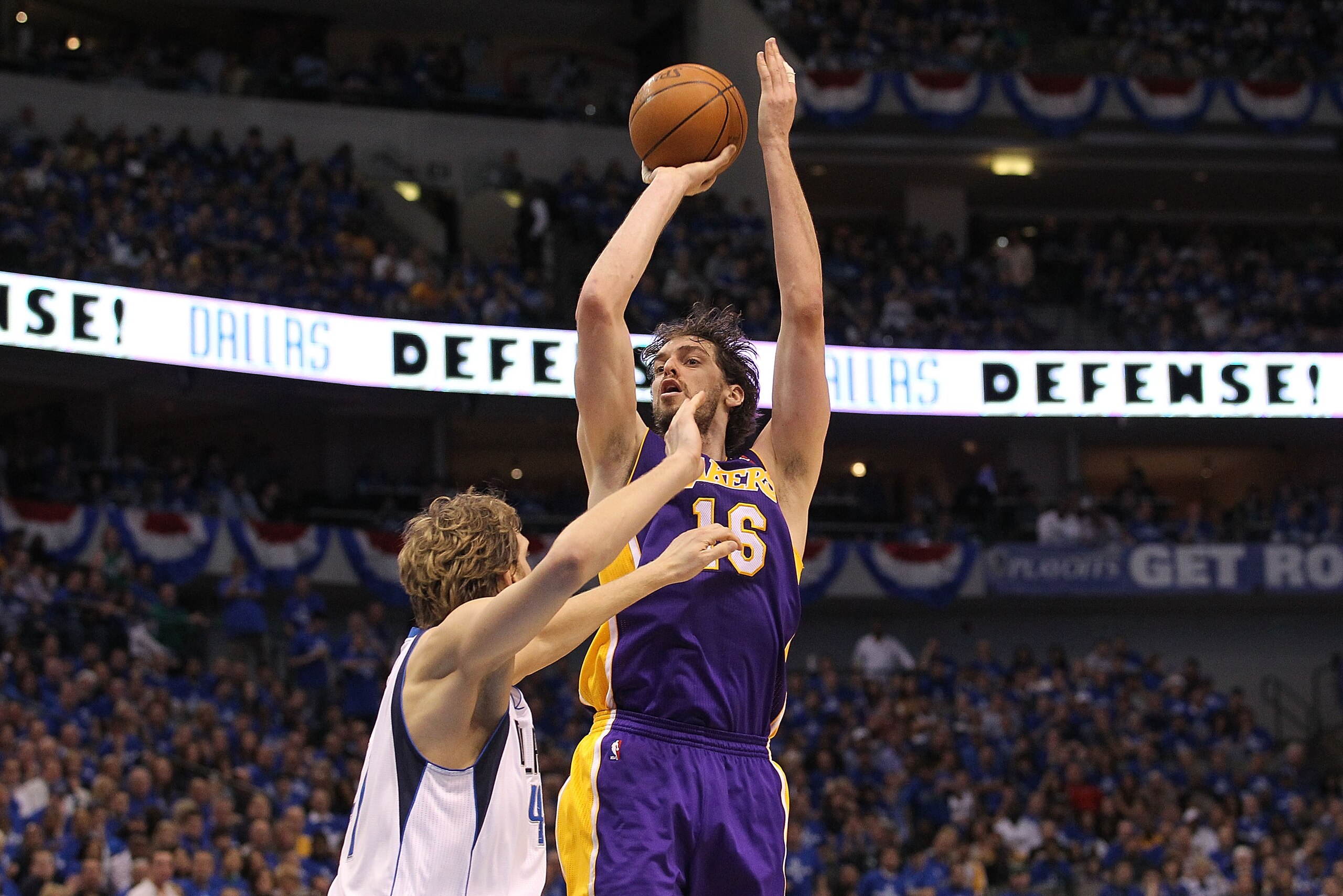 DALLAS, TX - MAY 06:  Forward Pau Gasol #16 of the Los Angeles Lakers takes a shot against Dirk Nowitzki #41 of the Dallas Mavericks in Game Three of the Western Conference Semifinals during the 2011 NBA Playoffs on May 6, 2011 at American Airlines Center