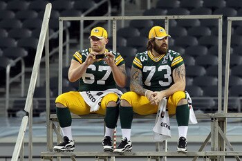ARLINGTON, TX - FEBRUARY 01:  Nick McDonald #67 and Daryn Colledge #73 of the Green Bay Packers wait for the start of Super Bowl XLV Media Day ahead of Super Bowl XLV at Cowboys Stadium on February 1, 2011 in Arlington, Texas. The Pittsburgh Steelers will