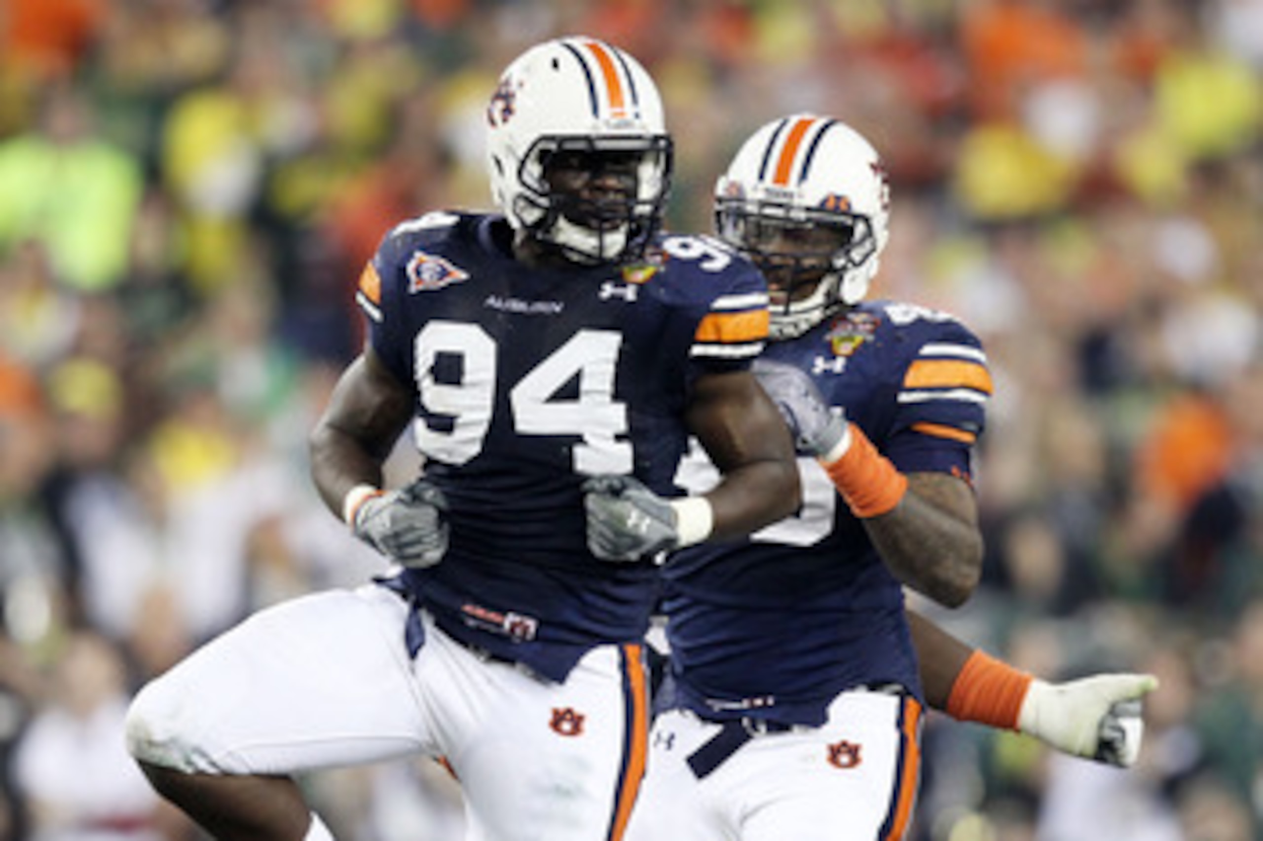 GLENDALE, AZ - JANUARY 10: Nosa Eguae #94 and Antoine Carter #45 of the Auburn Tigers celebrate against the Oregon Ducks during the Tostitos BCS National Championship Game at University of Phoenix Stadium on January 10, 2011 in Glendale, Arizona. (Photo GLENDALE, AZ - JANUARY 10: Nosa Eguae #94 and Antoine Carter #45 of the Auburn Tigers celebrate against the Oregon Ducks during the Tostitos BCS National Championship Game at University of Phoenix Stadium on January 10, 2011 in Glendale, Arizona. (Photo