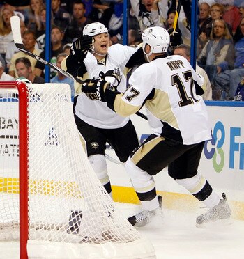 TAMPA, FL - APRIL 18: Arron Asham #45 of the Pittsburgh Penguins celebrates a goal with teammate Michael Rupp #17 against the Tampa Bay Lightning in Game Three of the Eastern Conference Quarterfinals during the 2011 NHL Stanley Cup Playoffs at the St. Pet