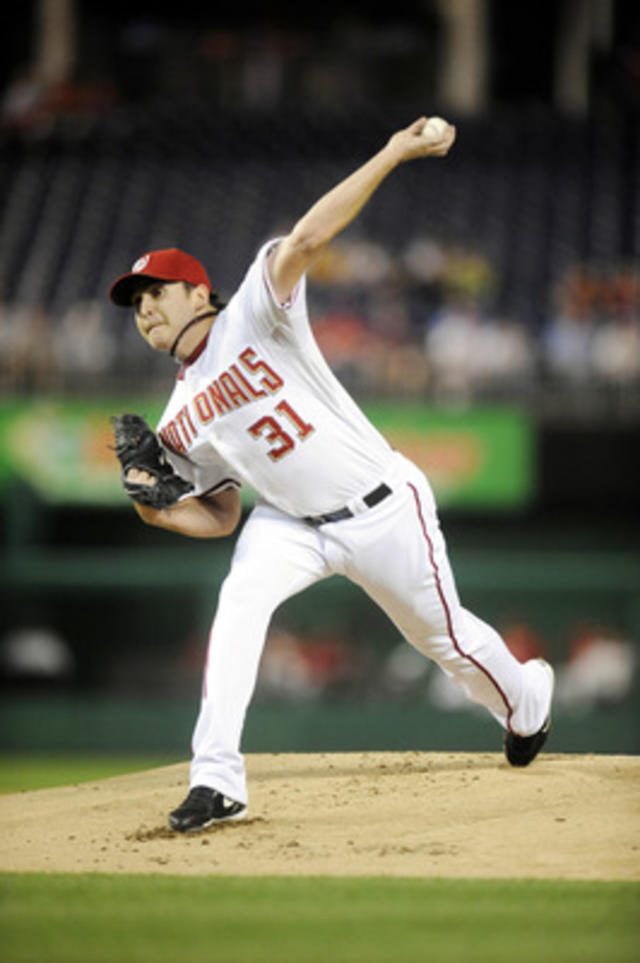 WASHINGTON - SEPTEMBER 27:  John Lannan #31 of the Washington Nationals pitches during a baseball game against the Philadelphia Phillies on September 27, 2010 at Nationals Park in Washington, D.C.    (Photo by Mitchell Layton/Getty Images)