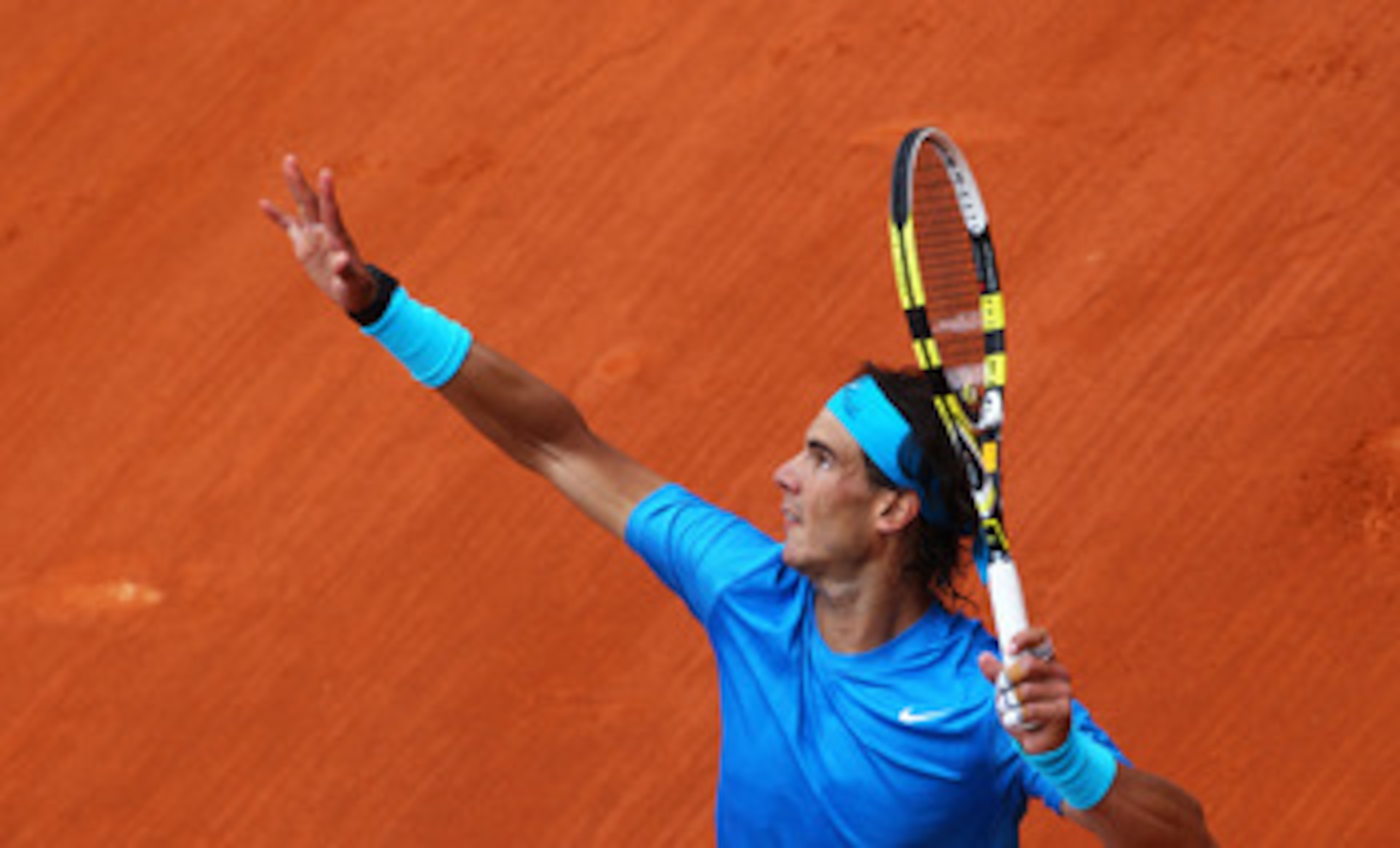 PARIS, FRANCE - MAY 30:  Rafael Nadal of Spain serves during the men's singles round four match between Rafael Nadal of Spain and Ivan Lubicic of Croatia on day nine of the French Open at Roland Garros on May 30, 2011 in Paris, France.  (Photo by Clive Br