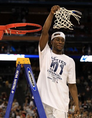 HOUSTON, TX - APRIL 04:  Kemba Walker #15 of the Connecticut Huskies cuts down the net after defeating the Butler Bulldogs to win the National Championship Game of the 2011 NCAA Division I Men's Basketball Tournament by a score of 53-41 at Reliant Stadium