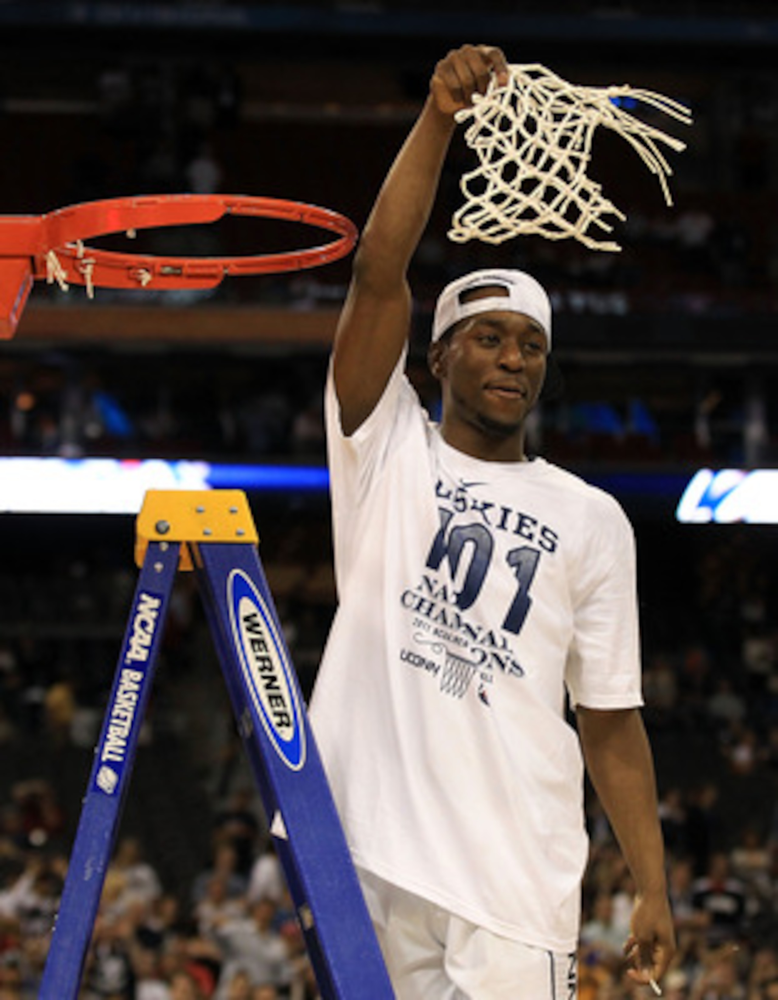 HOUSTON, TX - APRIL 04:  Kemba Walker #15 of the Connecticut Huskies cuts down the net after defeating the Butler Bulldogs to win the National Championship Game of the 2011 NCAA Division I Men's Basketball Tournament by a score of 53-41 at Reliant Stadium