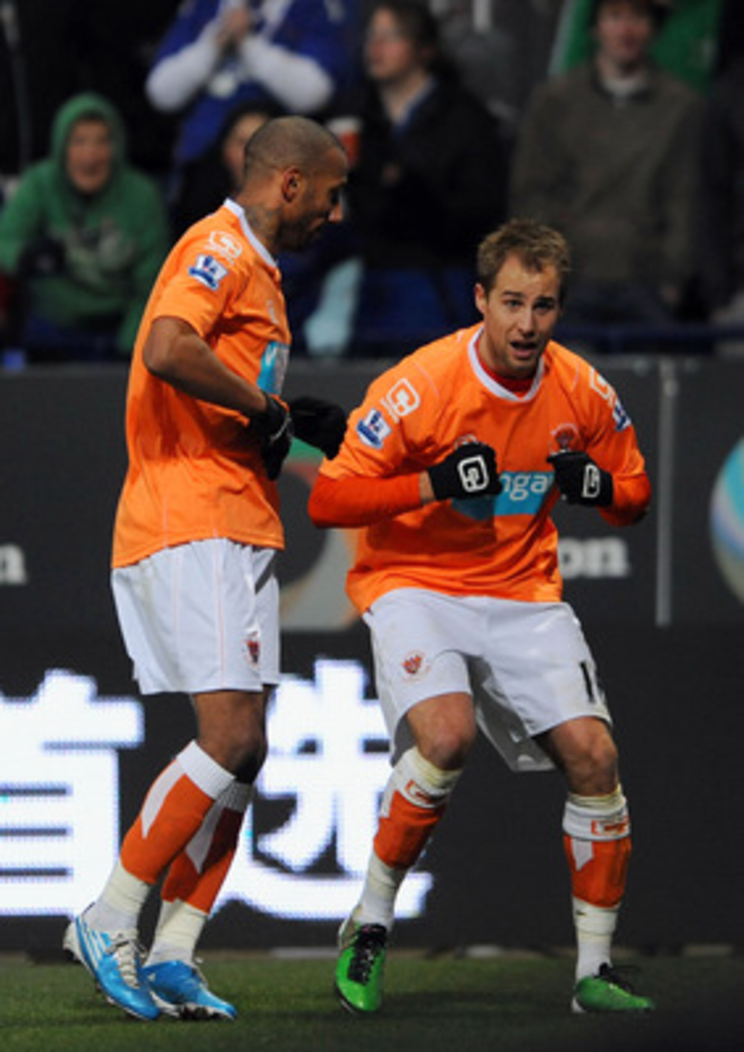 BOLTON, UNITED KINGDOM - NOVEMBER 27: Luke Varney (R) of Blackpool celebrates after scoring the second goal of the game during the Barclays Premier League match between Bolton Wanderers and Blackpool at the Reebok Stadium on November 27, 2010 in Bolton, E