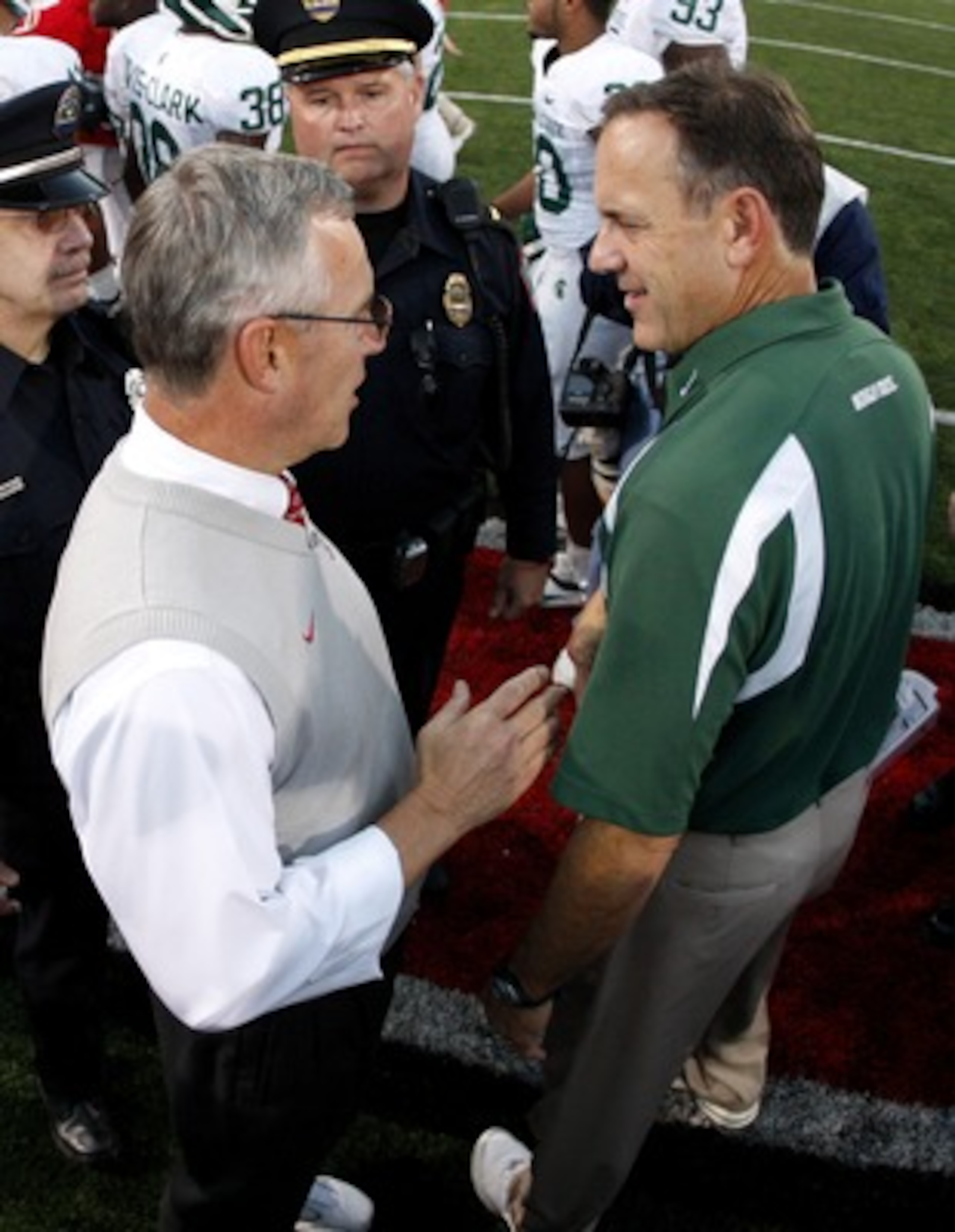 COLUMBUS, OH - OCTOBER 20: Jim Tressel head coach of the Ohio State Buckeyes shakes hands after 24-17 victory with Mark Dantonio head coach of the Michigan State Spartans at Ohio Stadium October 20, 2007 in Columbus, Ohio. (Photo By Gregory Shamus/Getty I COLUMBUS, OH - OCTOBER 20: Jim Tressel head coach of the Ohio State Buckeyes shakes hands after 24-17 victory with Mark Dantonio head coach of the Michigan State Spartans at Ohio Stadium October 20, 2007 in Columbus, Ohio. (Photo By Gregory Shamus/Getty I