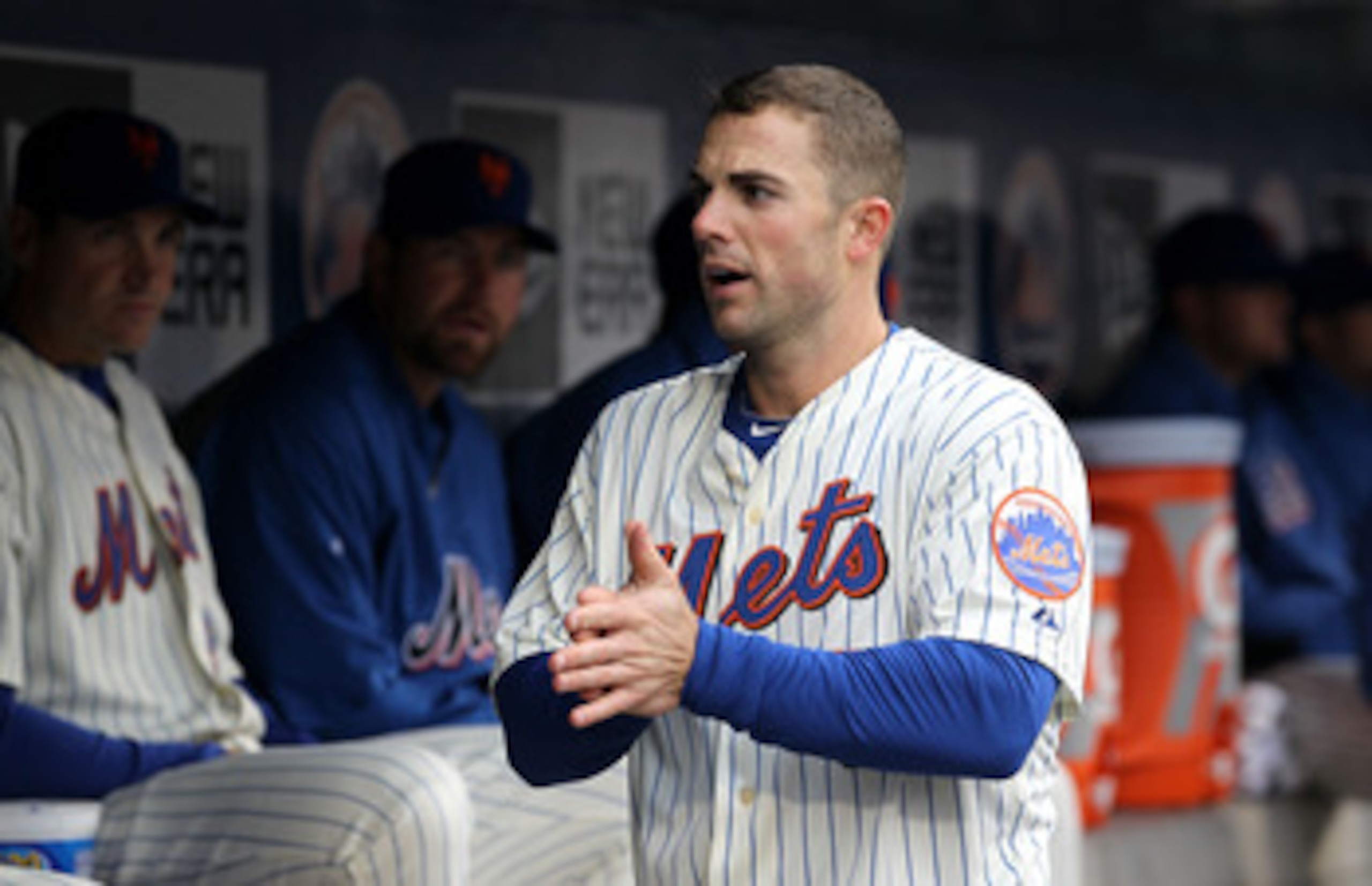 NEW YORK, NY - APRIL 08:  David Wright #5 of the New York Mets looks on from the dugout against the Washington Nationals during the Mets' Home Opener at Citi Field on April 8, 2011 in the Flushing neighborhood of Queens in New York City.  (Photo by Al Bel