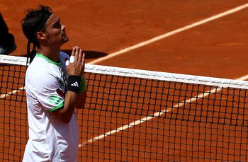PARIS, FRANCE - MAY 29:  Fabio Fognini of Italy appeals to the crowd as he is booed after winning the men's singles round four match between Fabio Fognini of Italy and Albert Montanes of Spain on day eight of the French Open at Roland Garros on May 29, 20