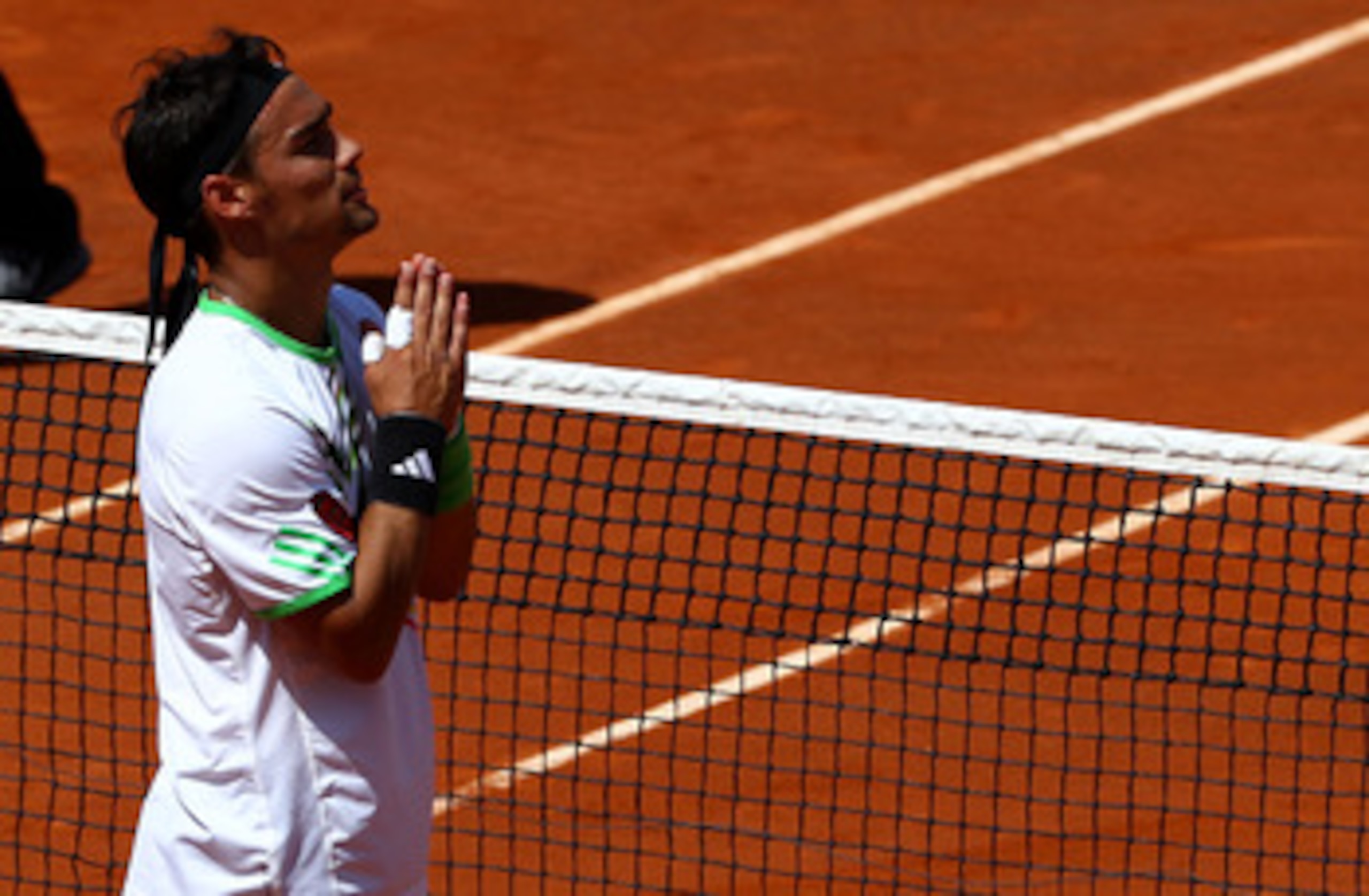 PARIS, FRANCE - MAY 29:  Fabio Fognini of Italy appeals to the crowd as he is booed after winning the men's singles round four match between Fabio Fognini of Italy and Albert Montanes of Spain on day eight of the French Open at Roland Garros on May 29, 20