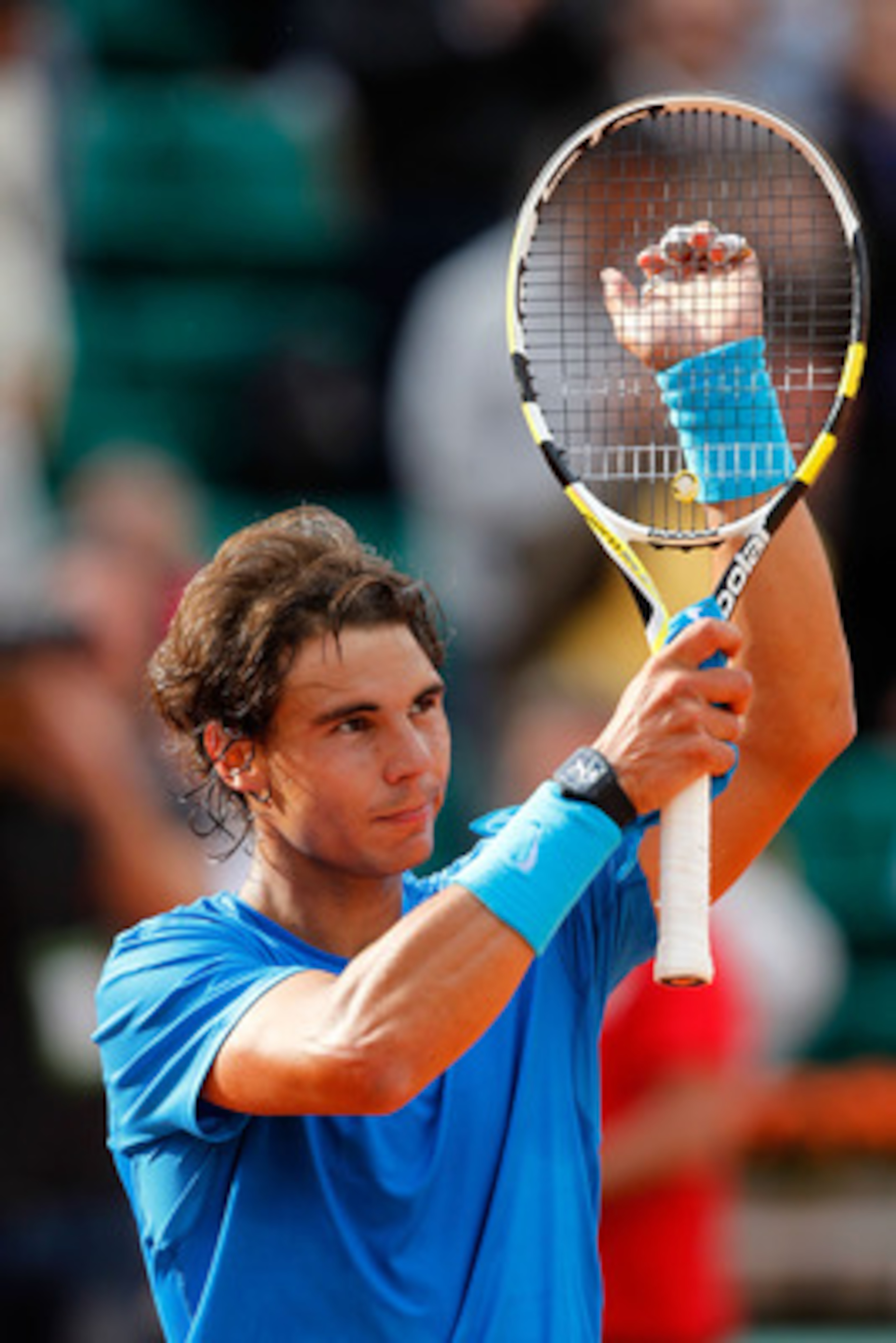 PARIS, FRANCE - MAY 26: Rafael Nadal of Spain applauds the fans following his victory during the men's singles round two match between Rafael Nadal of Spain and Pablo Andujar of Spain on day five of the French Open at Roland Garros on May 26, 2011 in Par PARIS, FRANCE - MAY 26: Rafael Nadal of Spain applauds the fans following his victory during the men's singles round two match between Rafael Nadal of Spain and Pablo Andujar of Spain on day five of the French Open at Roland Garros on May 26, 2011 in Par