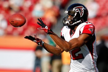 TAMPA, FL - DECEMBER 05:  Receiver Michael Jenkins #12 of the Atlanta Falcons catches a pass during warmups against the Tampa Bay Buccaneers at Raymond James Stadium on December 5, 2010 in Tampa, Florida.  (Photo by J. Meric/Getty Images)