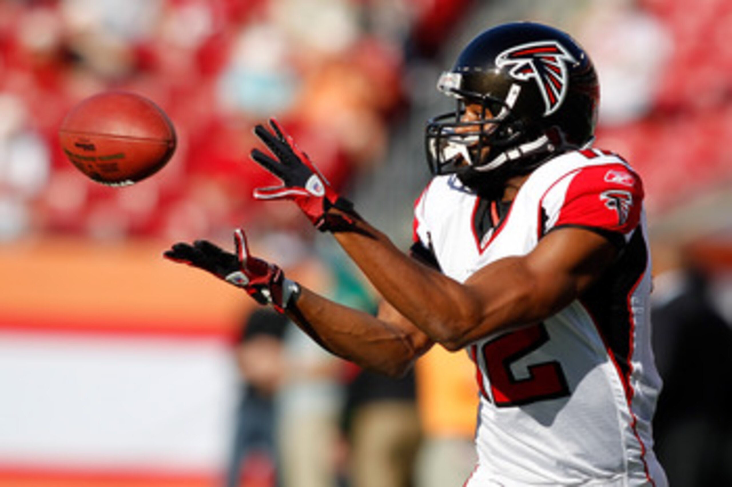 TAMPA, FL - DECEMBER 05: Receiver Michael Jenkins #12 of the Atlanta Falcons catches a pass during warmups against the Tampa Bay Buccaneers at Raymond James Stadium on December 5, 2010 in Tampa, Florida. (Photo by J. Meric/Getty Images) TAMPA, FL - DECEMBER 05: Receiver Michael Jenkins #12 of the Atlanta Falcons catches a pass during warmups against the Tampa Bay Buccaneers at Raymond James Stadium on December 5, 2010 in Tampa, Florida. (Photo by J. Meric/Getty Images)