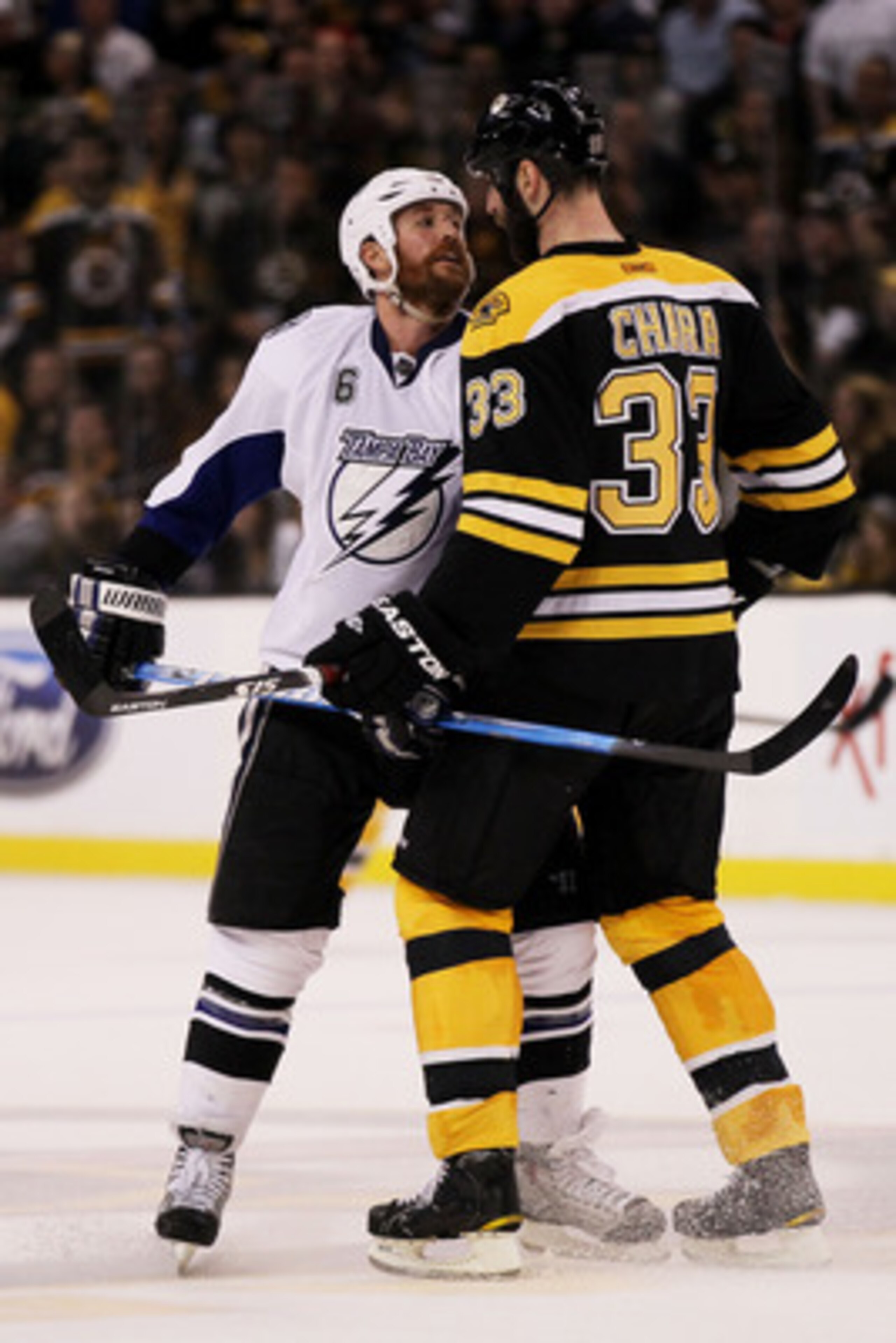 BOSTON, MA - MAY 23:  Ryan Malone #6 of the Tampa Bay Lightning and Zdeno Chara #33 of the Boston Bruins exchange words in Game Five of the Eastern Conference Finals during the 2011 NHL Stanley Cup Playoffs at TD Garden on May 23, 2011 in Boston, Massachu