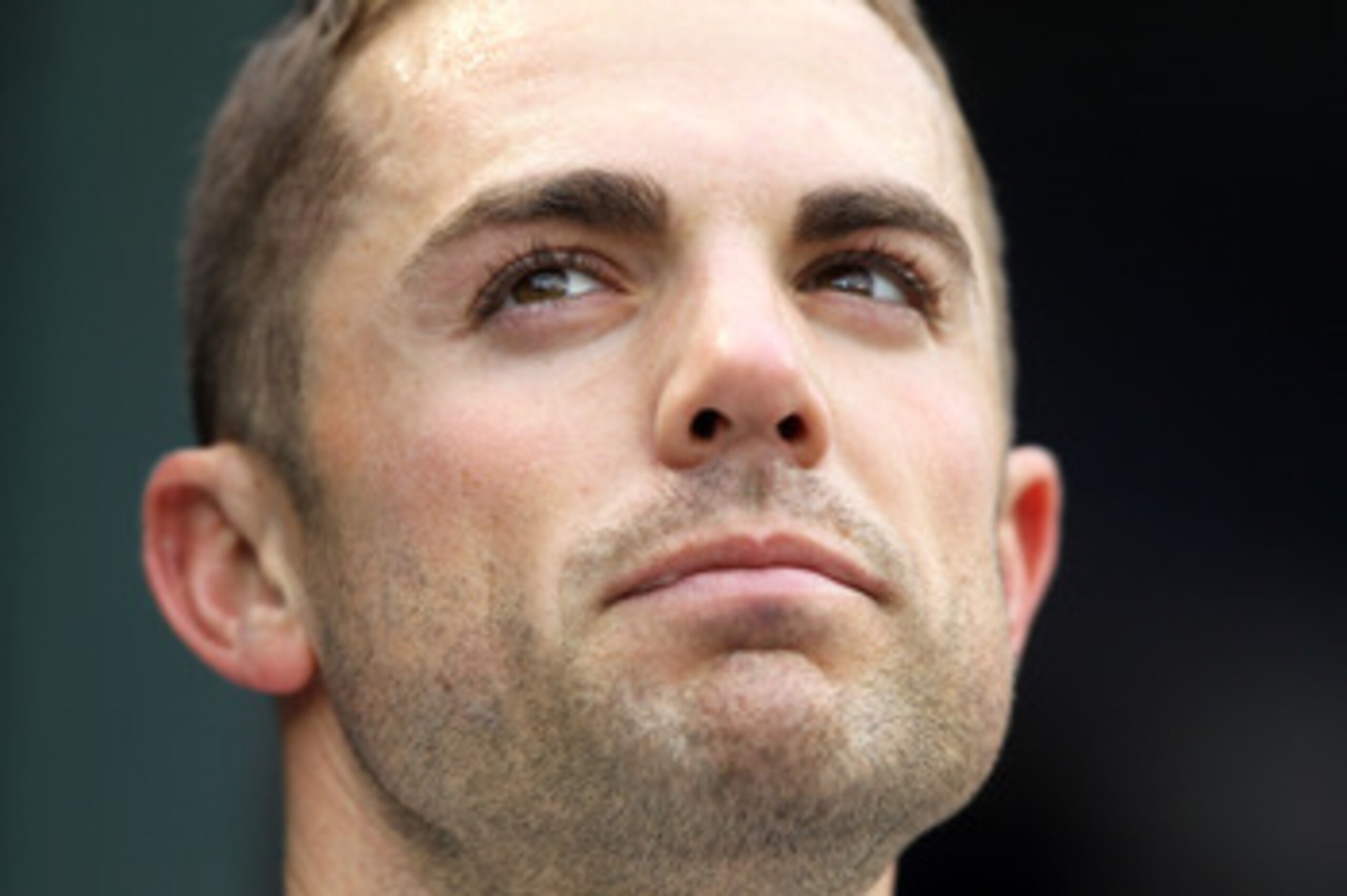 NEW YORK, NY - APRIL 08:  David Wright #5 of the New York Mets looks on from the dugout against the Washington Nationals during the Mets' Home Opener at Citi Field on April 8, 2011 in the Flushing neighborhood of Queens in New York City.  (Photo by Al Bel