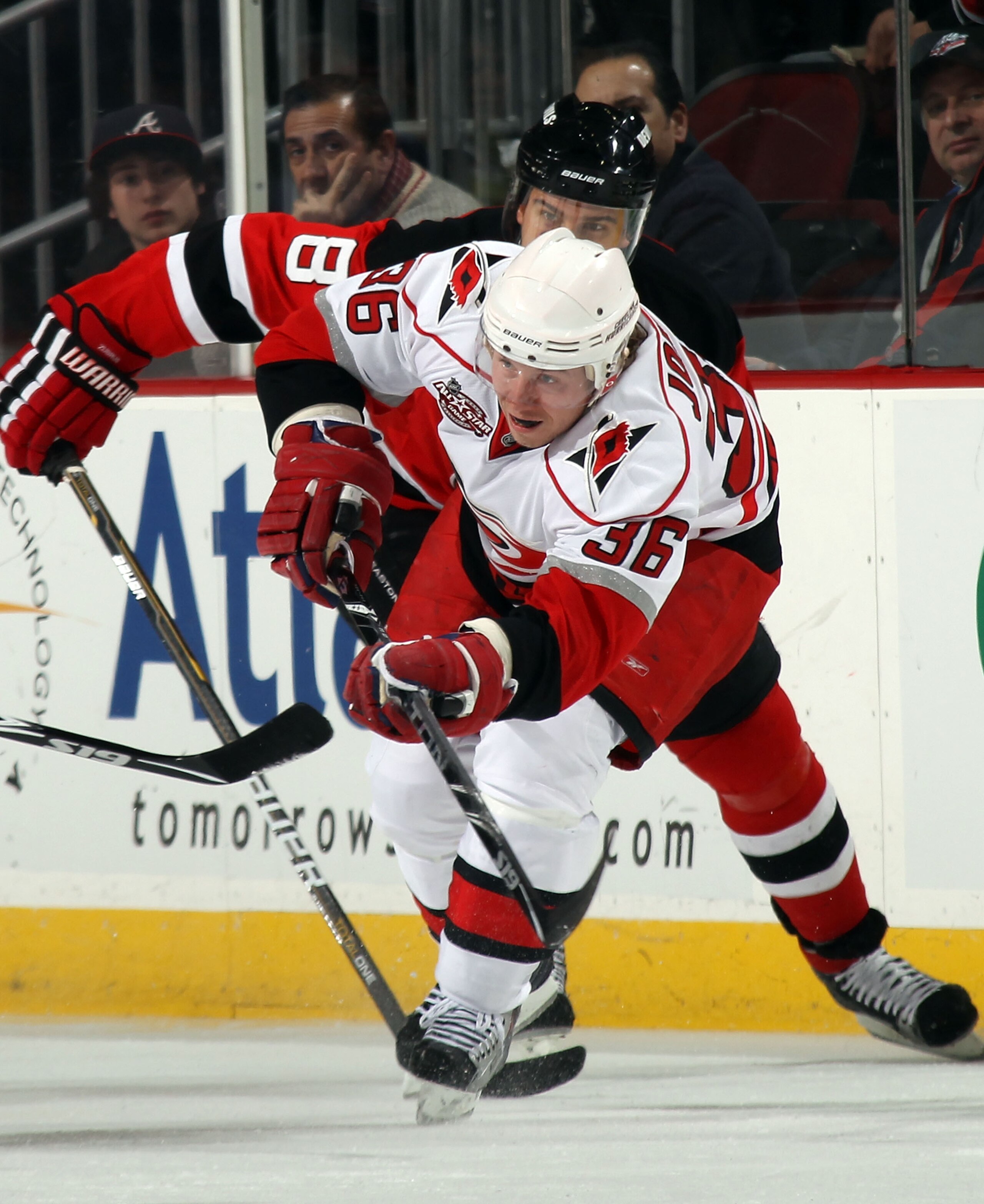 NEWARK, NJ - FEBRUARY 16:  Jussi Jokinen #36 of the Carolina Hurricanes takes a shot through a crowd against the New Jersey Devils at the Prudential Center on February 16, 2011 in Newark, New Jersey.  (Photo by Bruce Bennett/Getty Images)