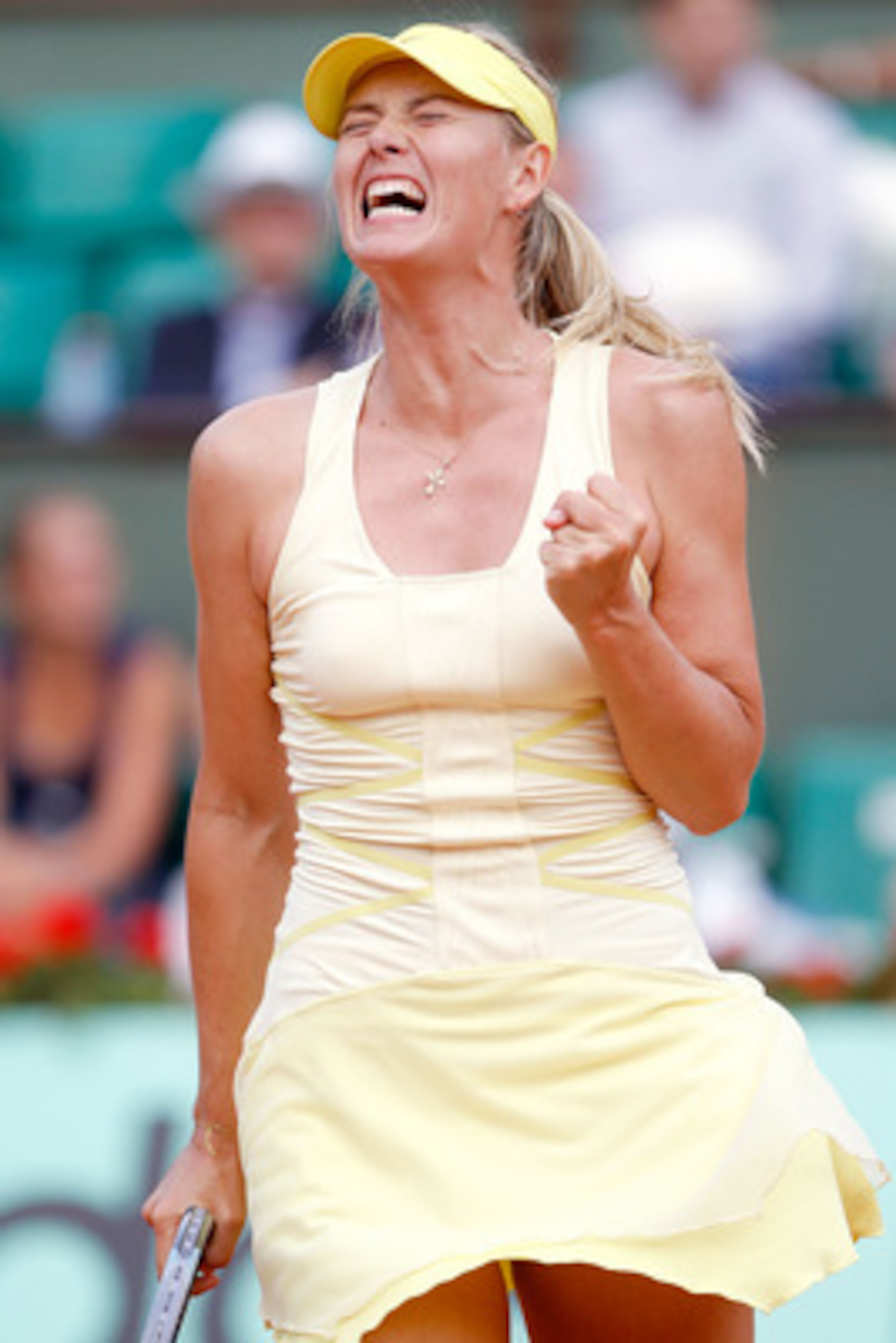 PARIS, FRANCE - MAY 30:  Maria Sharapova of Russia  celebrates winning the first set during the women's singles round four match between Maria Sharapova of Russia and Agnieszka Radwanska of Poland on day nine of the French Open at Roland Garros on May 30,
