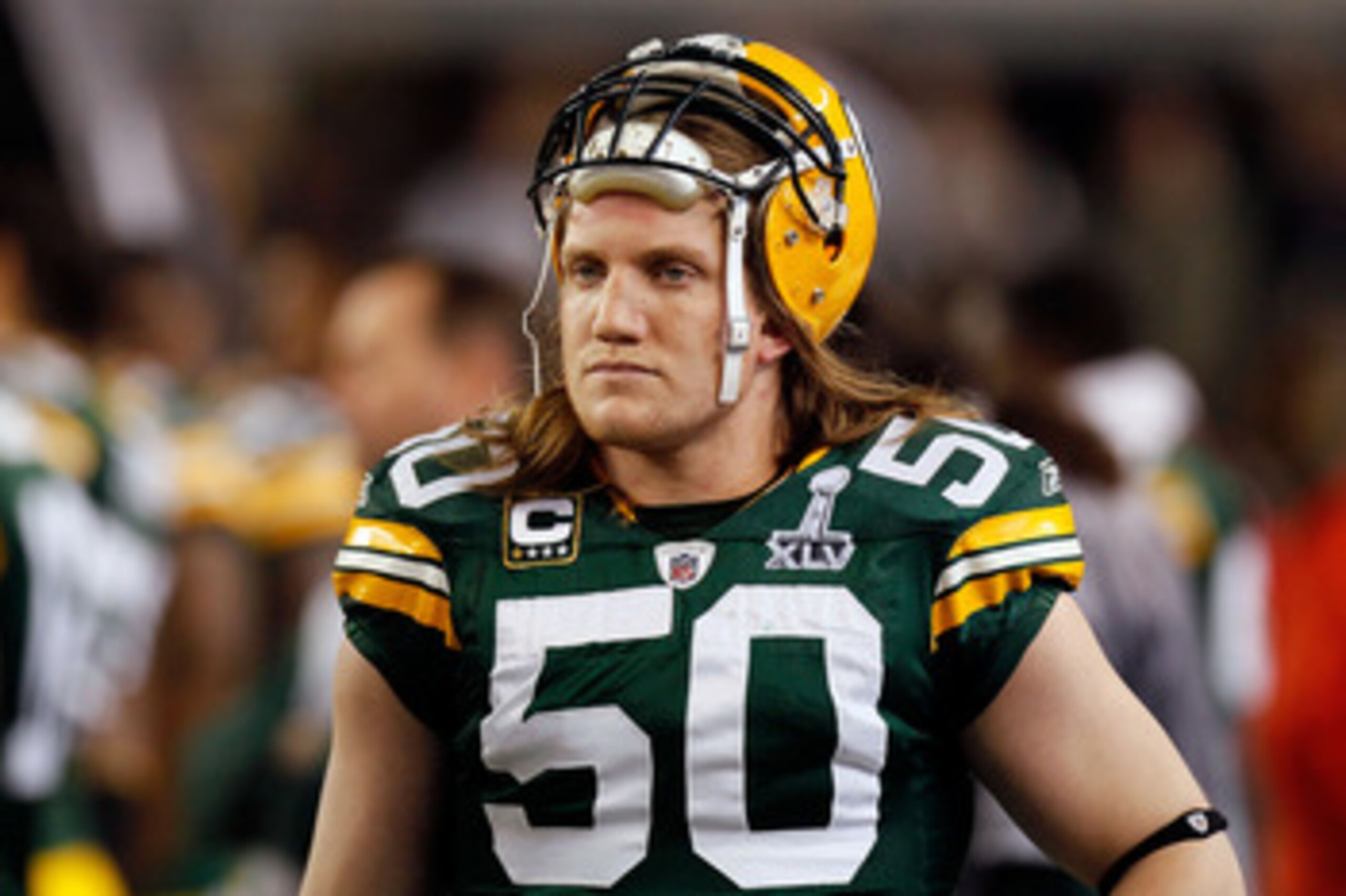 ARLINGTON, TX - FEBRUARY 06: A.J. Hawk #50 of the Green Bay Packers looks on from the sideline against the Pittsburgh Steelers during Super Bowl XLV at Cowboys Stadium on February 6, 2011 in Arlington, Texas. The Packers won 31-25. (Photo by Kevin C. Cox ARLINGTON, TX - FEBRUARY 06: A.J. Hawk #50 of the Green Bay Packers looks on from the sideline against the Pittsburgh Steelers during Super Bowl XLV at Cowboys Stadium on February 6, 2011 in Arlington, Texas. The Packers won 31-25. (Photo by Kevin C. Cox