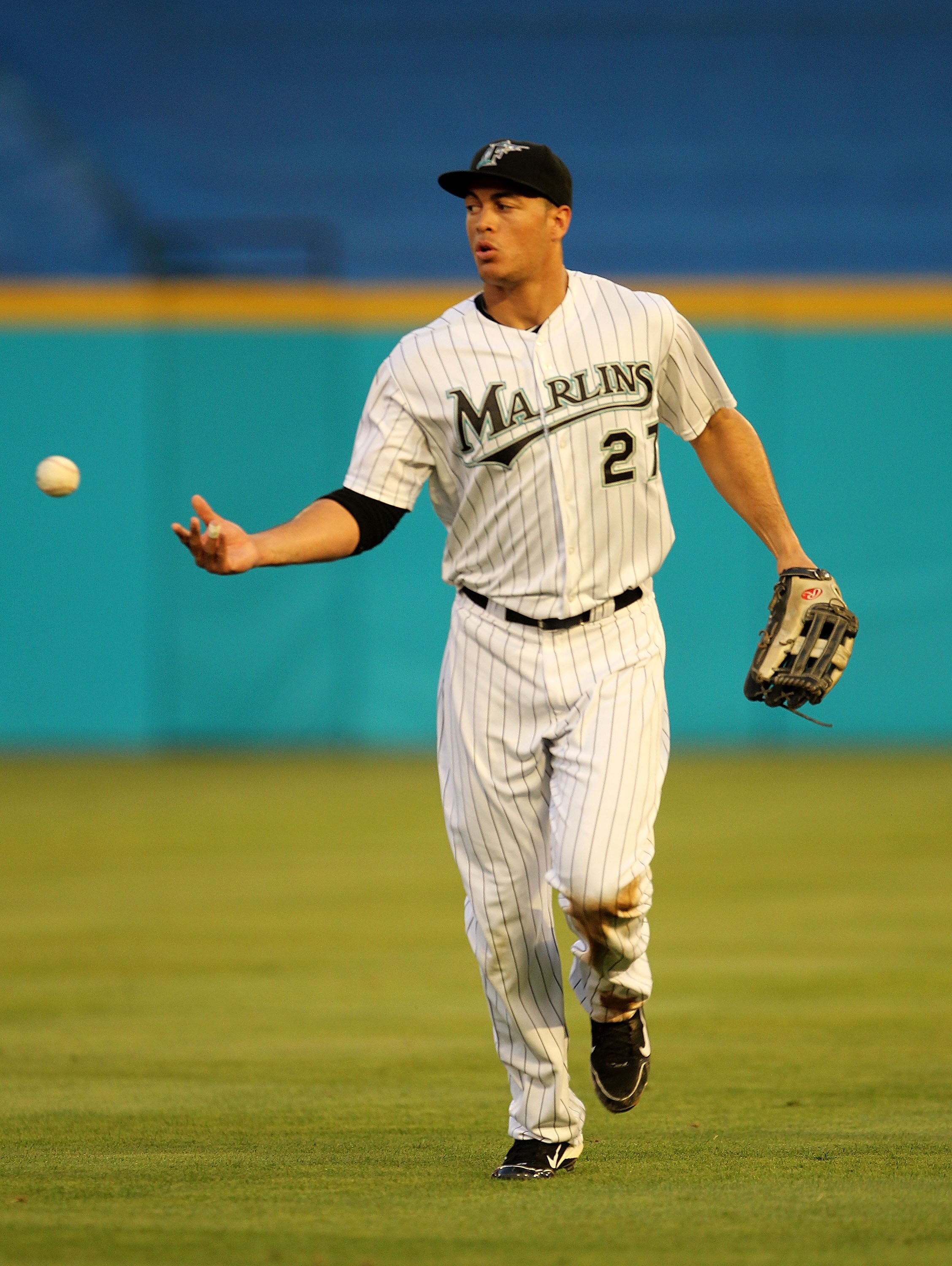 MIAMI GARDENS, FL - MAY 18:  Mike Stanton #27 of the Florida Marlins tosses the ball after making a catch during a game against the Chicago Cubs at Sun Life Stadium on May 18, 2011 in Miami Gardens, Florida.  (Photo by Mike Ehrmann/Getty Images)
