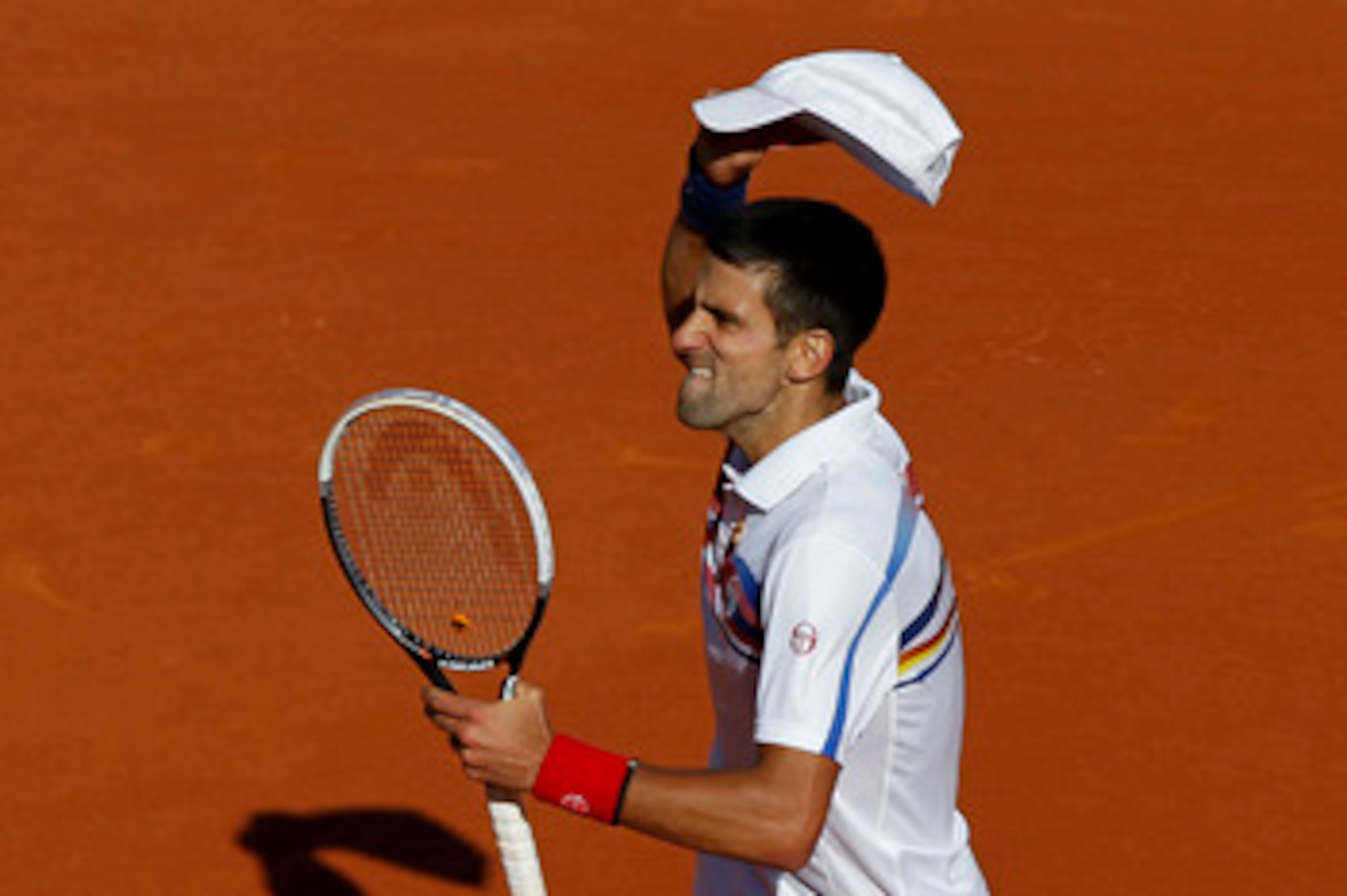 PARIS, FRANCE - MAY 29:  Novak Djokovic of Serbia celebrates matchpoint during the men's singles round four match between Richard Gasquet of France and Novak Djokovic of Serbia on day eight of the French Open at Roland Garros on May 29, 2011 in Paris, Fra