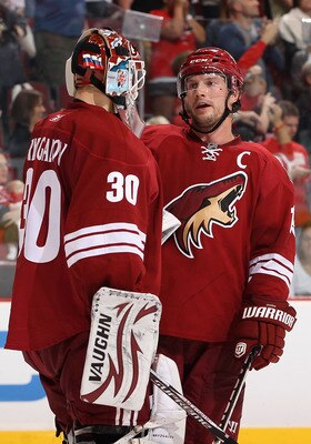 GLENDALE, AZ - APRIL 20:  Shane Doan #19 of the Phoenix Coyotes talks with goaltender Ilya Bryzgalov #30 after being defeated by the Detroit Red Wings in Game Four of the Western Conference Quarterfinals during the 2011 NHL Stanley Cup Playoffs at Jobing.
