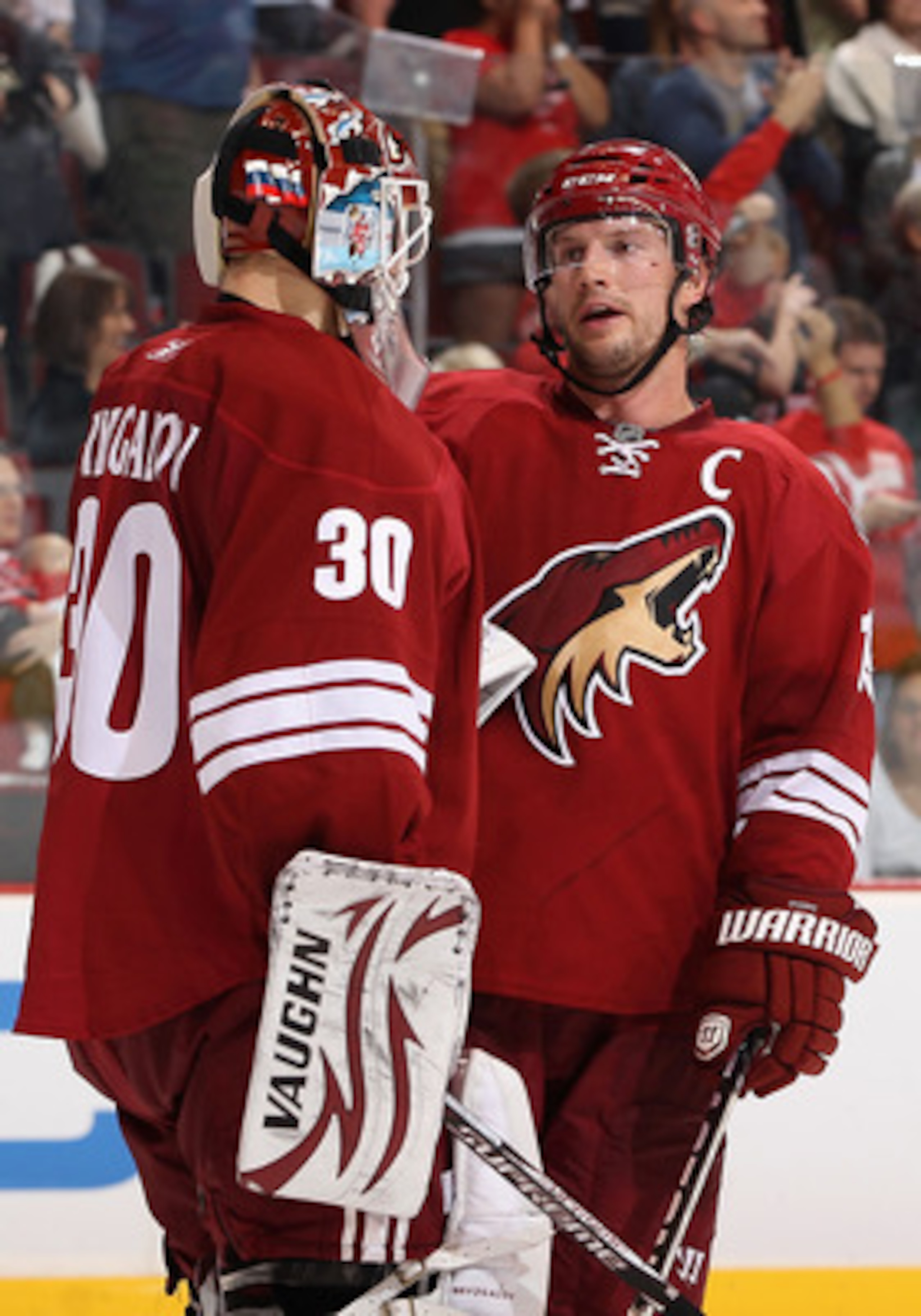 GLENDALE, AZ - APRIL 20:  Shane Doan #19 of the Phoenix Coyotes talks with goaltender Ilya Bryzgalov #30 after being defeated by the Detroit Red Wings in Game Four of the Western Conference Quarterfinals during the 2011 NHL Stanley Cup Playoffs at Jobing.