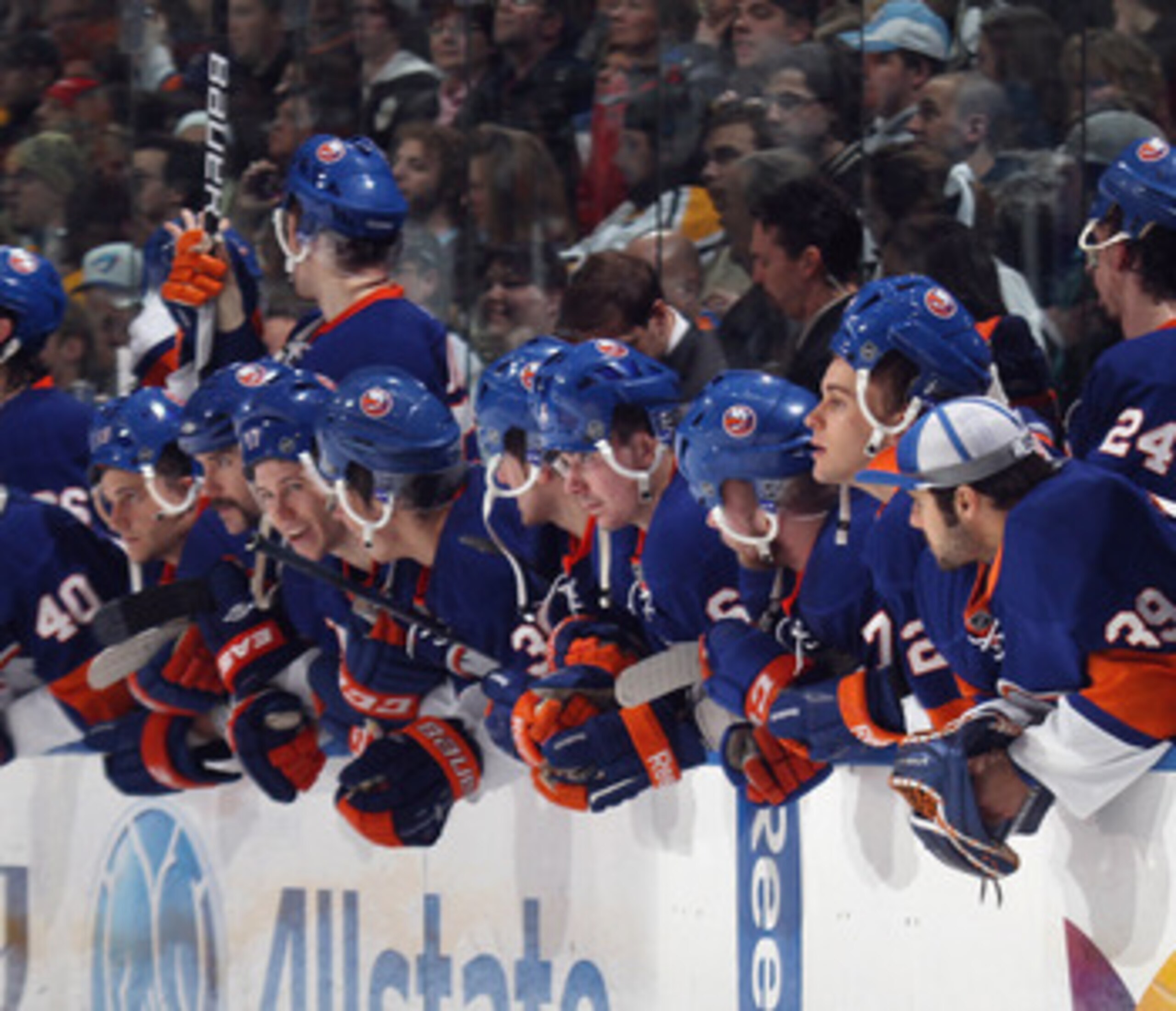 UNIONDALE, NY - APRIL 08:  The New York Islanders watch the shoot out against the Pittsburgh Penguins with their helmets on backwards for good luck at the Nassau Coliseum on April 8, 2011 in Uniondale, New York.  (Photo by Bruce Bennett/Getty Images)