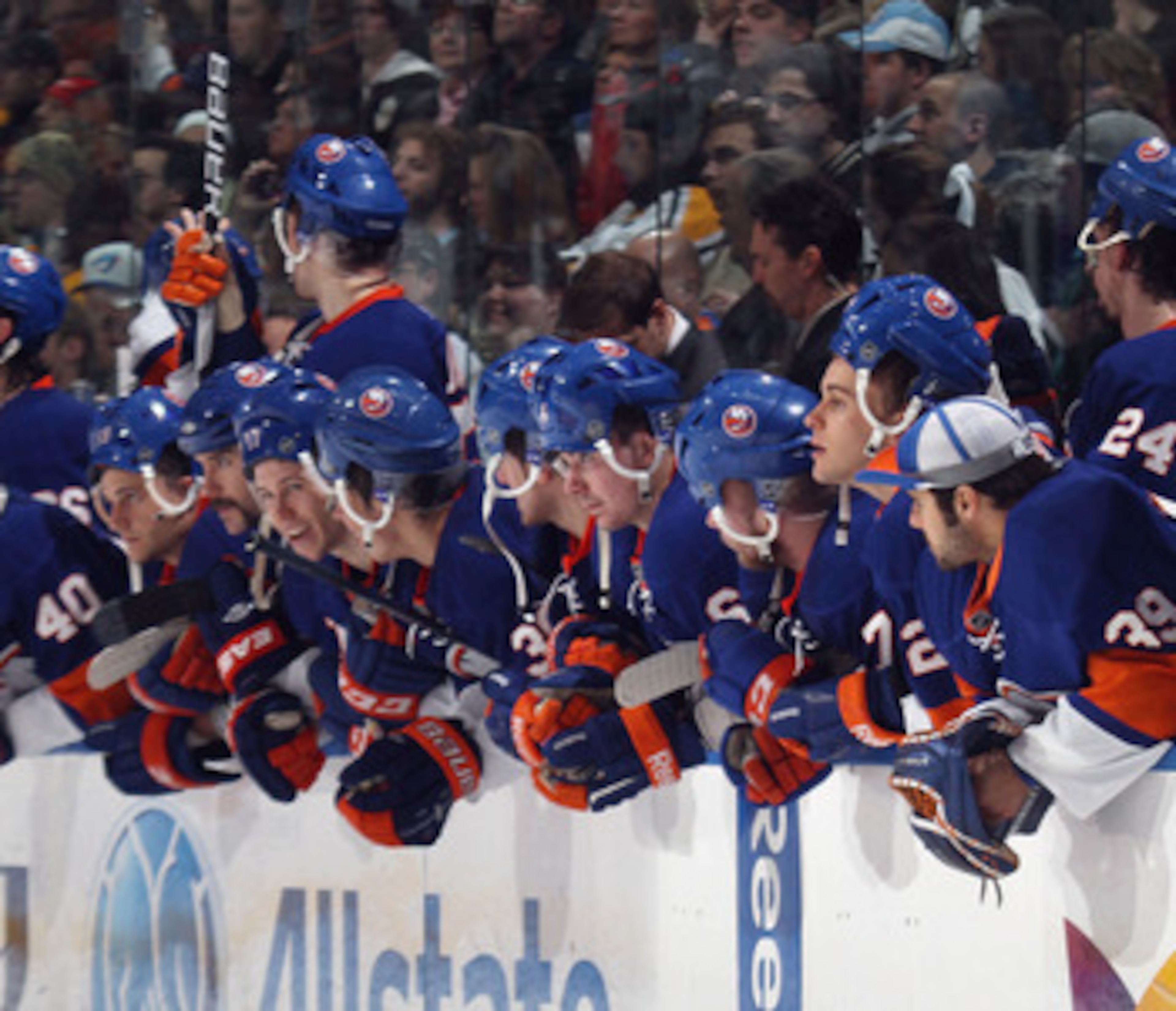 UNIONDALE, NY - APRIL 08:  The New York Islanders watch the shoot out against the Pittsburgh Penguins with their helmets on backwards for good luck at the Nassau Coliseum on April 8, 2011 in Uniondale, New York.  (Photo by Bruce Bennett/Getty Images)