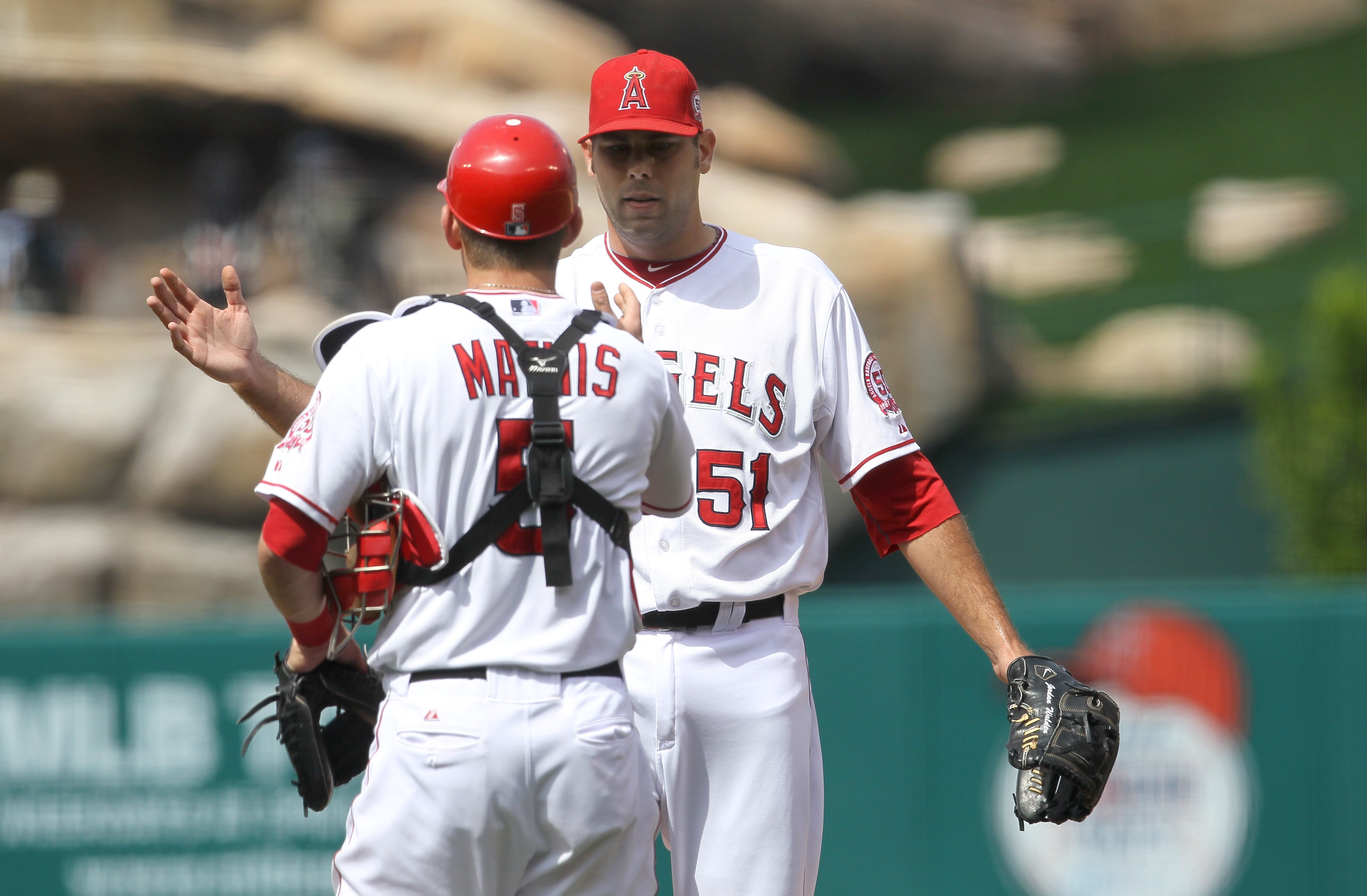 ANAHEIM, CA - MAY 22:   Relief pitcher Jordan Walden and catcher Jeff Mathis #5 of the Los Angeles Angels of Anaheim celebrate after getting the final out against the Atlanta Braves on May 22, 2011 at Angel Stadium in Anaheim, California.   The Angels won