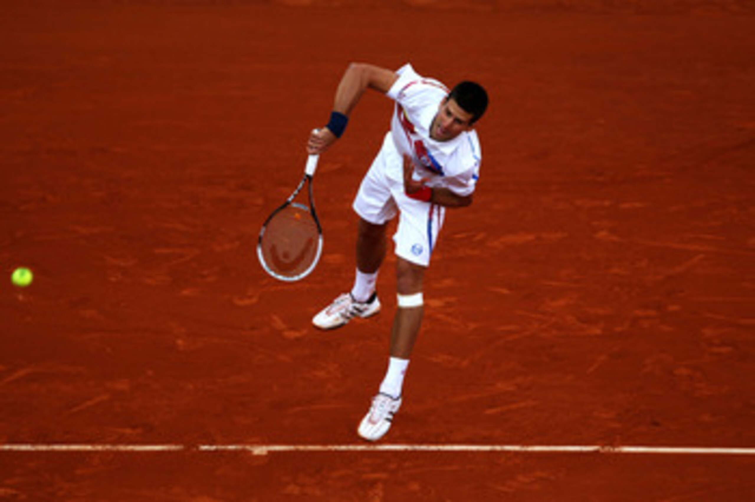 PARIS, FRANCE - MAY 27:  Novak Djokovic of Serbia serves during the men's singles round three match between Juan Martin Del Potro of Argentina and Novak Djokovic of Serbia on day six of the French Open at Roland Garros on May 27, 2011 in Paris, France.  (