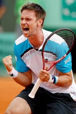 PARIS, FRANCE - MAY 30:  Robin Soderling of Sweden celebrates matchpoint during the men's singles round four match between Gilles Simon of France and Robin Soderling of Sweden on day nine of the French Open at Roland Garros on May 30, 2011 in Paris, Franc
