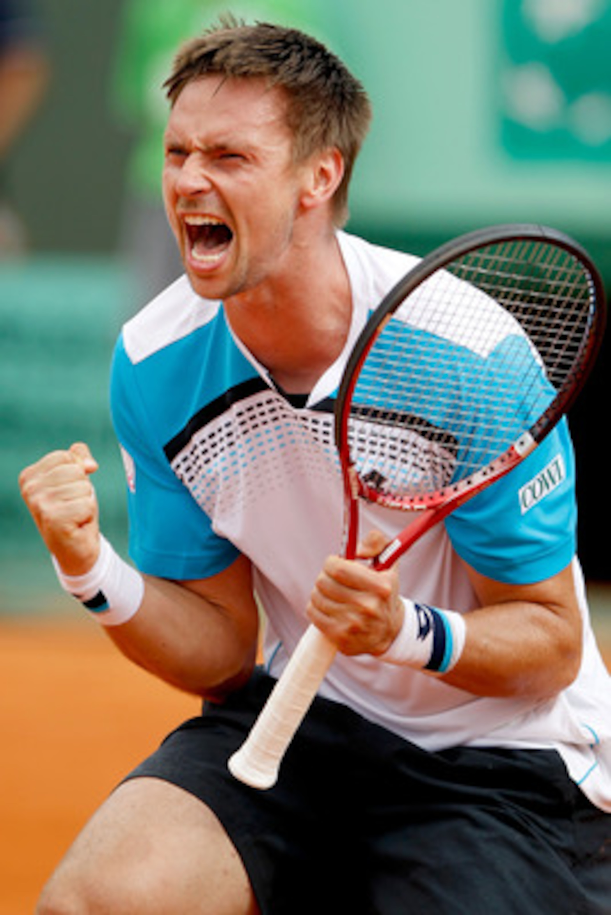 PARIS, FRANCE - MAY 30:  Robin Soderling of Sweden celebrates matchpoint during the men's singles round four match between Gilles Simon of France and Robin Soderling of Sweden on day nine of the French Open at Roland Garros on May 30, 2011 in Paris, Franc