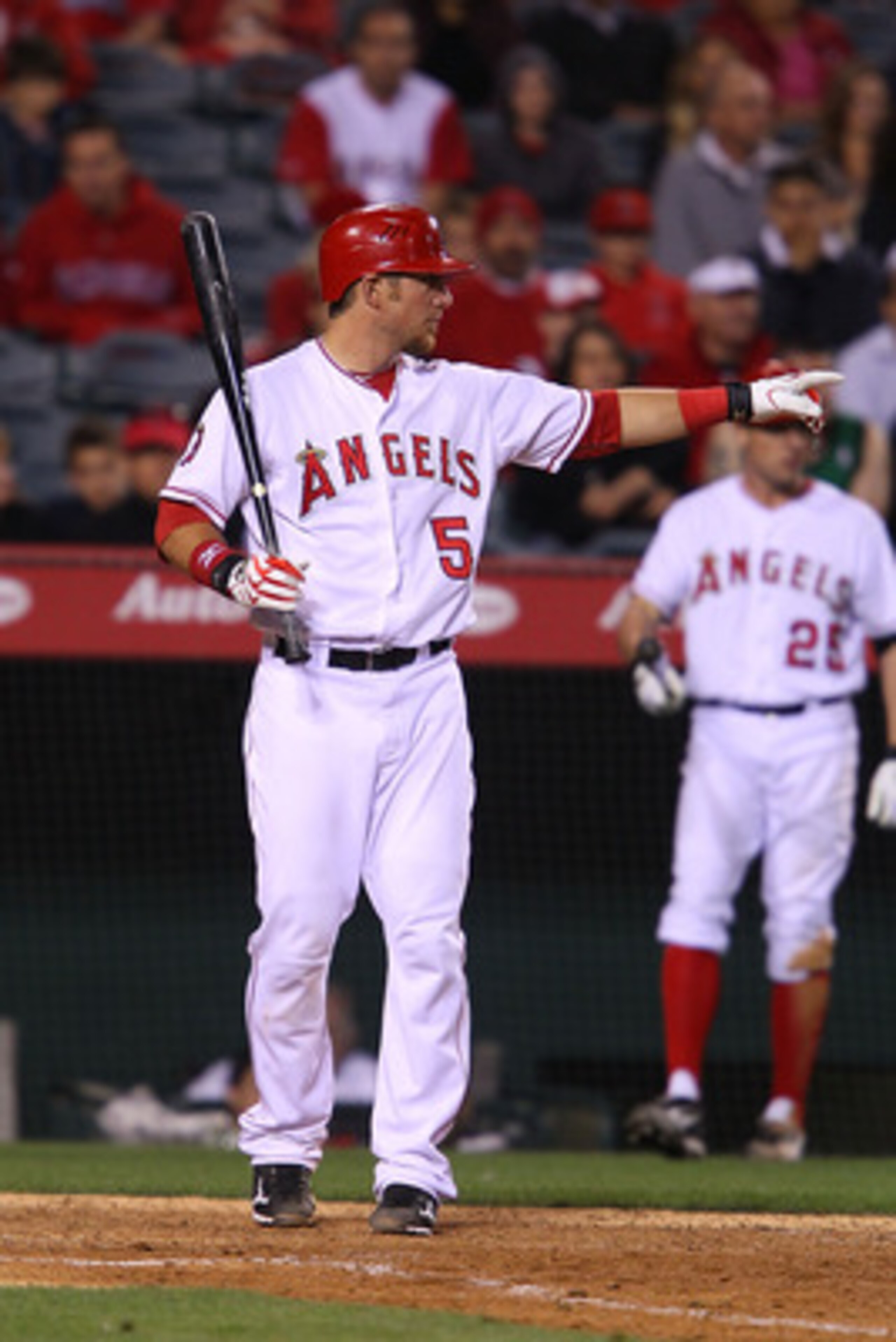 ANAHEIM, CA - MAY 23:  Jeff Mathis #5 of the Los Angeles Angeles of Anaheim asks for the third base coach to make a call during the game against the Oakland Athletics at Angel Stadium on May 23, 2011 in Anaheim, California.  (Photo by Joe Scarnici/Getty I