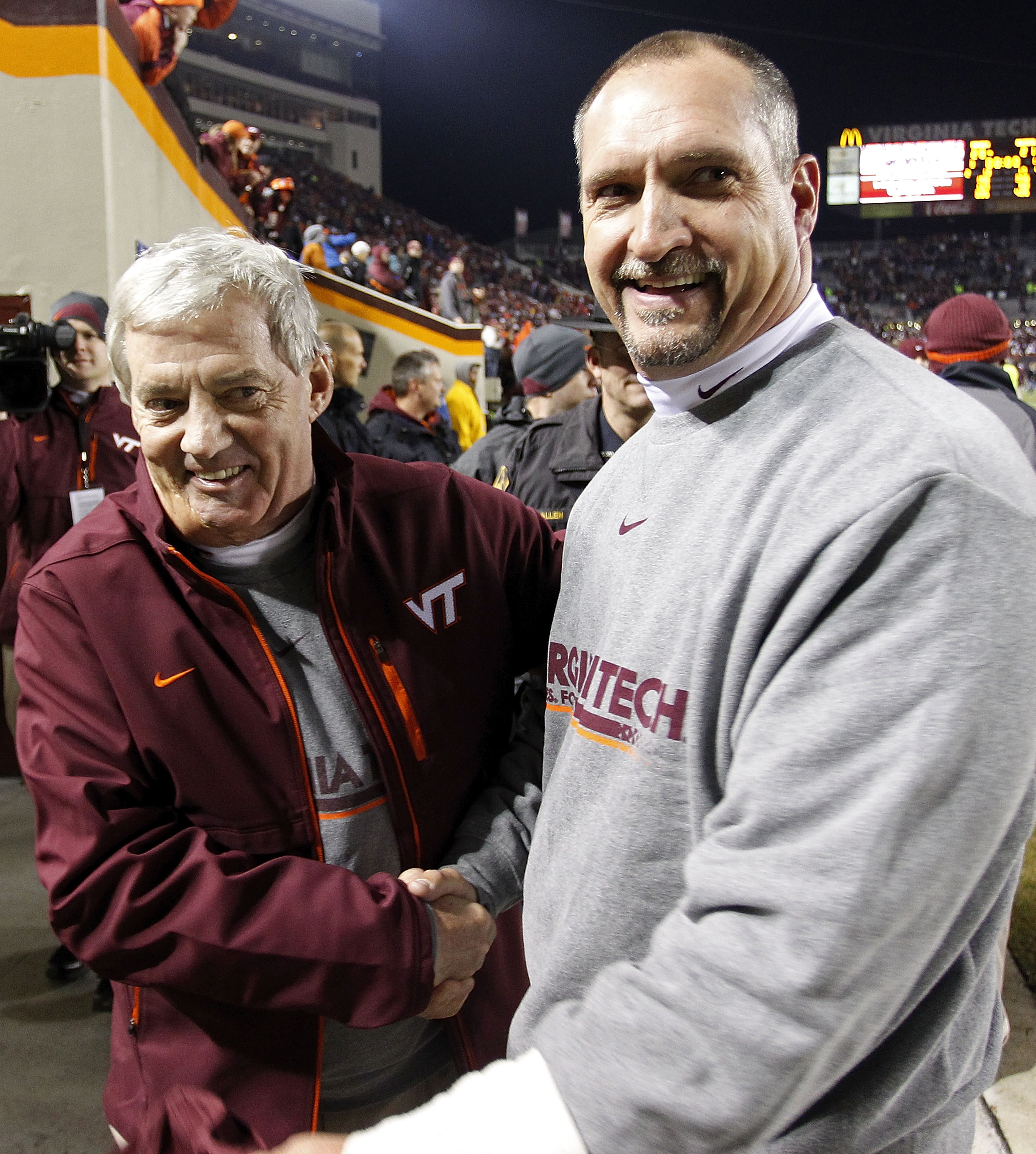 BLACKSBURG, VA - NOVEMBER 04: Head coach Frank Beamer (L) of the Virginia Tech Hokies celebrates with defensive coordinator Bud Foster (R) after the Hokies defeated the Georgia Tech Yellow Jackets 28-21 at Lane Stadium on November 4, 2010 in Blacksburg, V