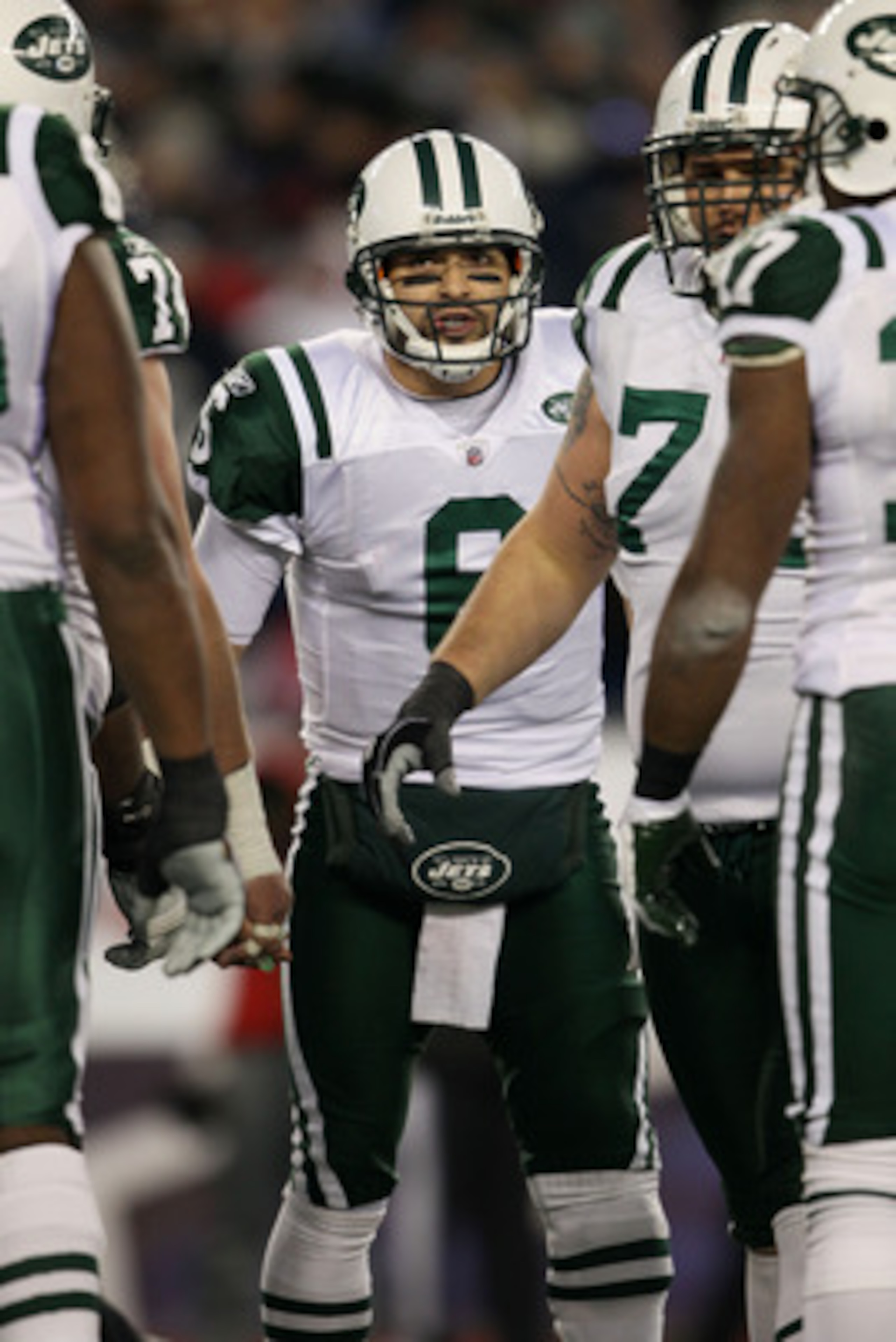 FOXBORO, MA - JANUARY 16:  Quarterback Mark Sanchez #6 of the New York Jets huddles with teammates against the New England Patriots during their 2011 AFC divisional playoff game at Gillette Stadium on January 16, 2011 in Foxboro, Massachusetts.  (Photo by